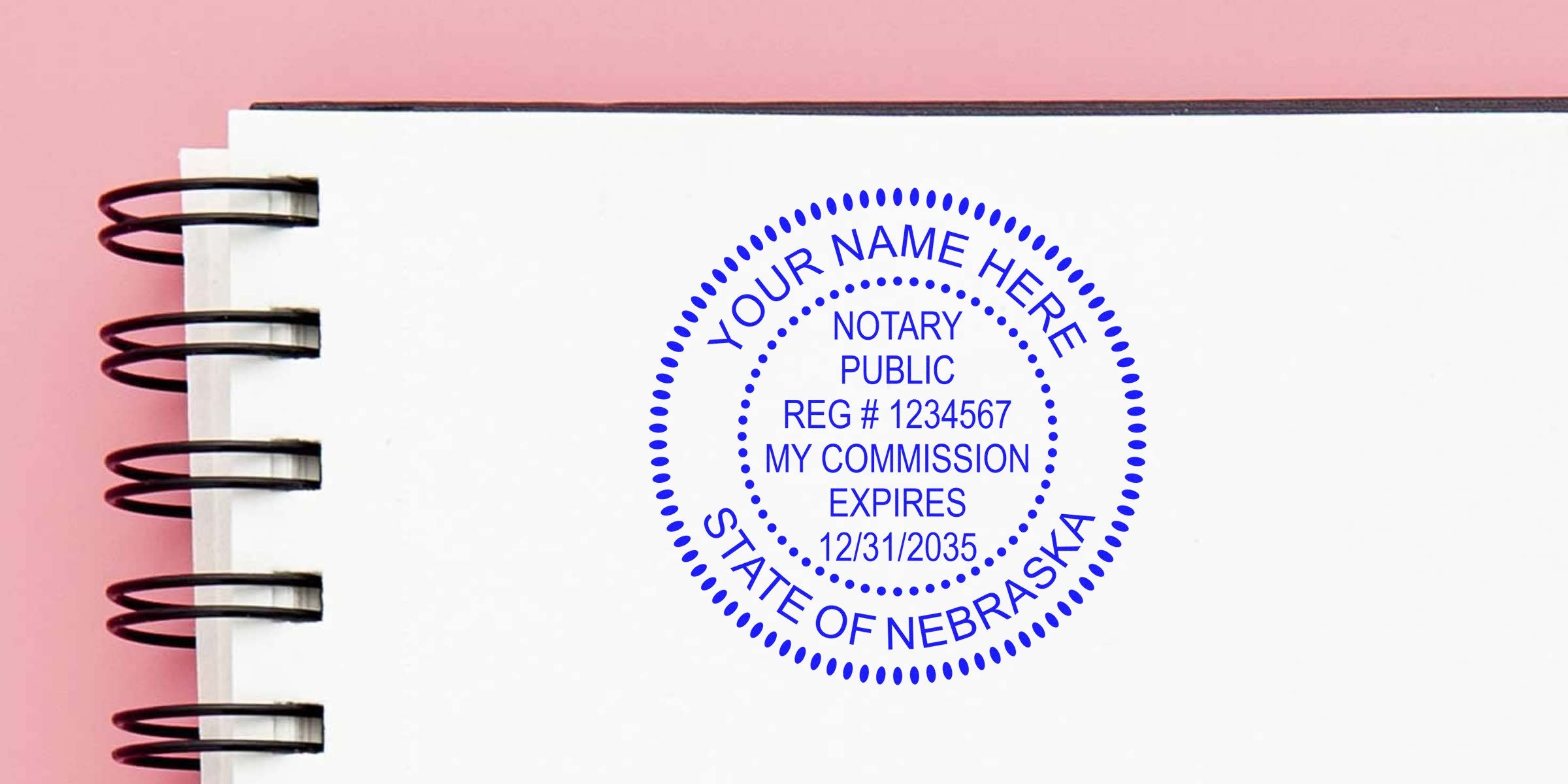Nebraska notary seal stamp with commission expiration date on white notebook page. Purchase your notary seal online today.
