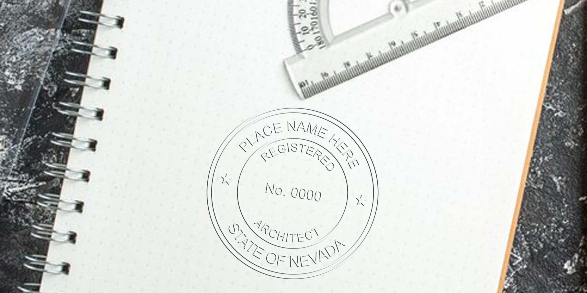 Blank architect notebook with ruler and protractor on black textured surface, featuring Nevada architect stamp size and registration requirements.
