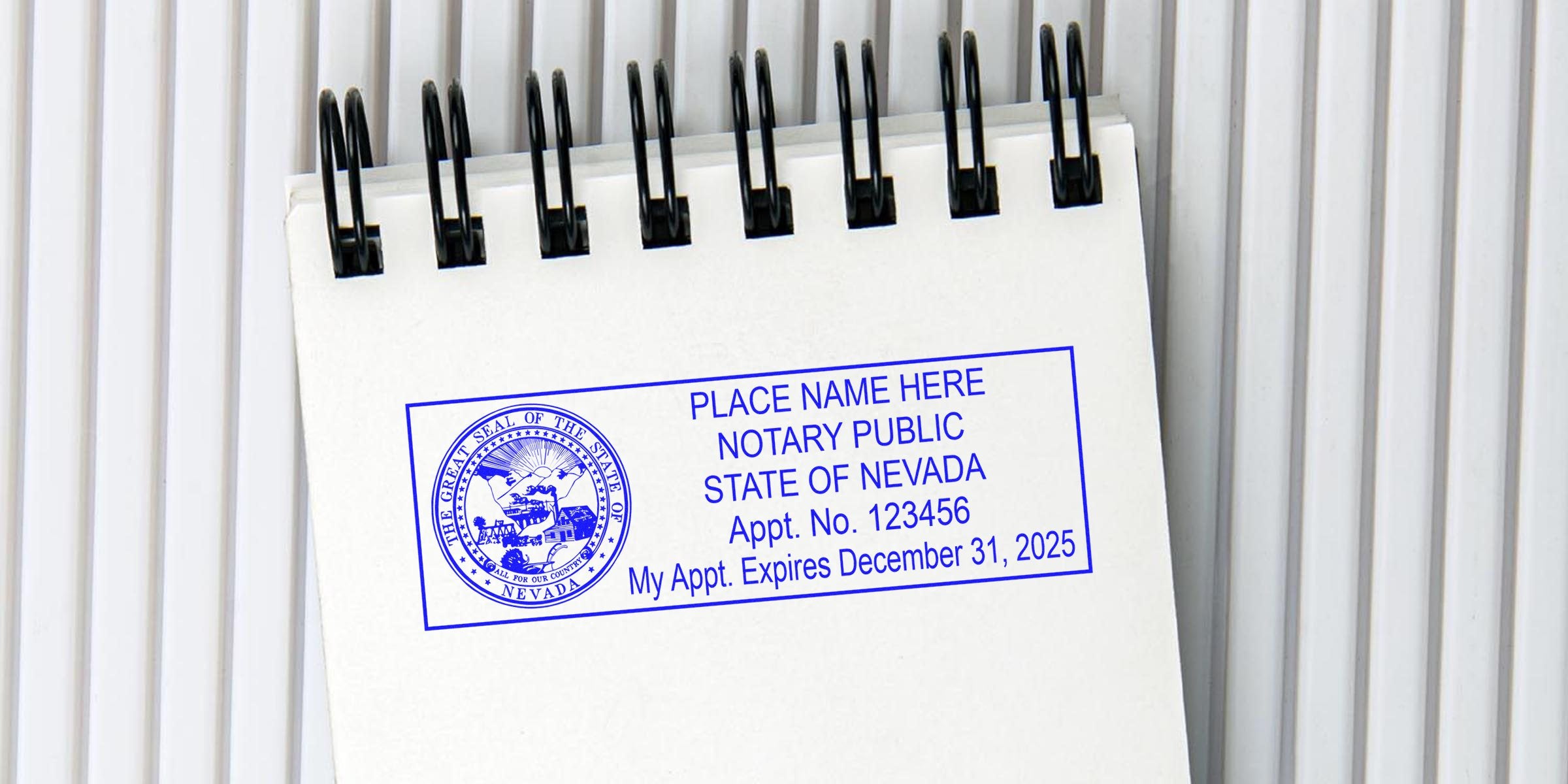 Nevada notary public stamp on a white spiral notebook showing the state seal and appointment expiration, illustrating Nevada notary stamp requirements and serving as a notary stamp guide.