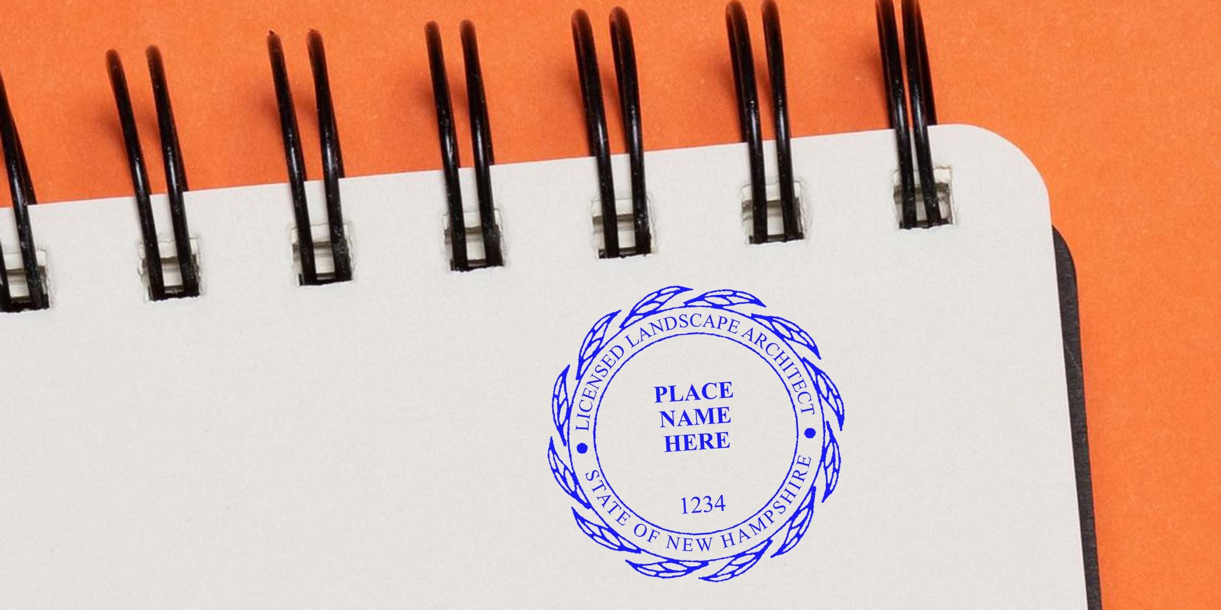 Blue licensed landscape architect stamp on white spiral notebook against orange background, showcasing New Hampshire stamp costs and NH postage rates.