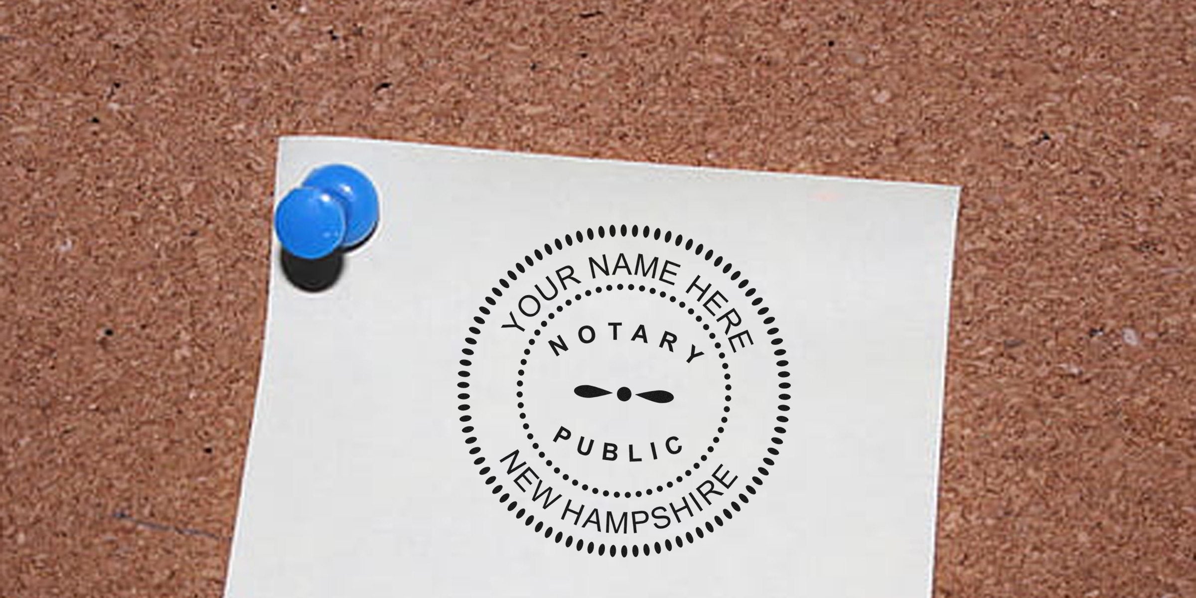 Notary public seal on white paper pinned to corkboard, showing New Hampshire notary duties and seal regulations.