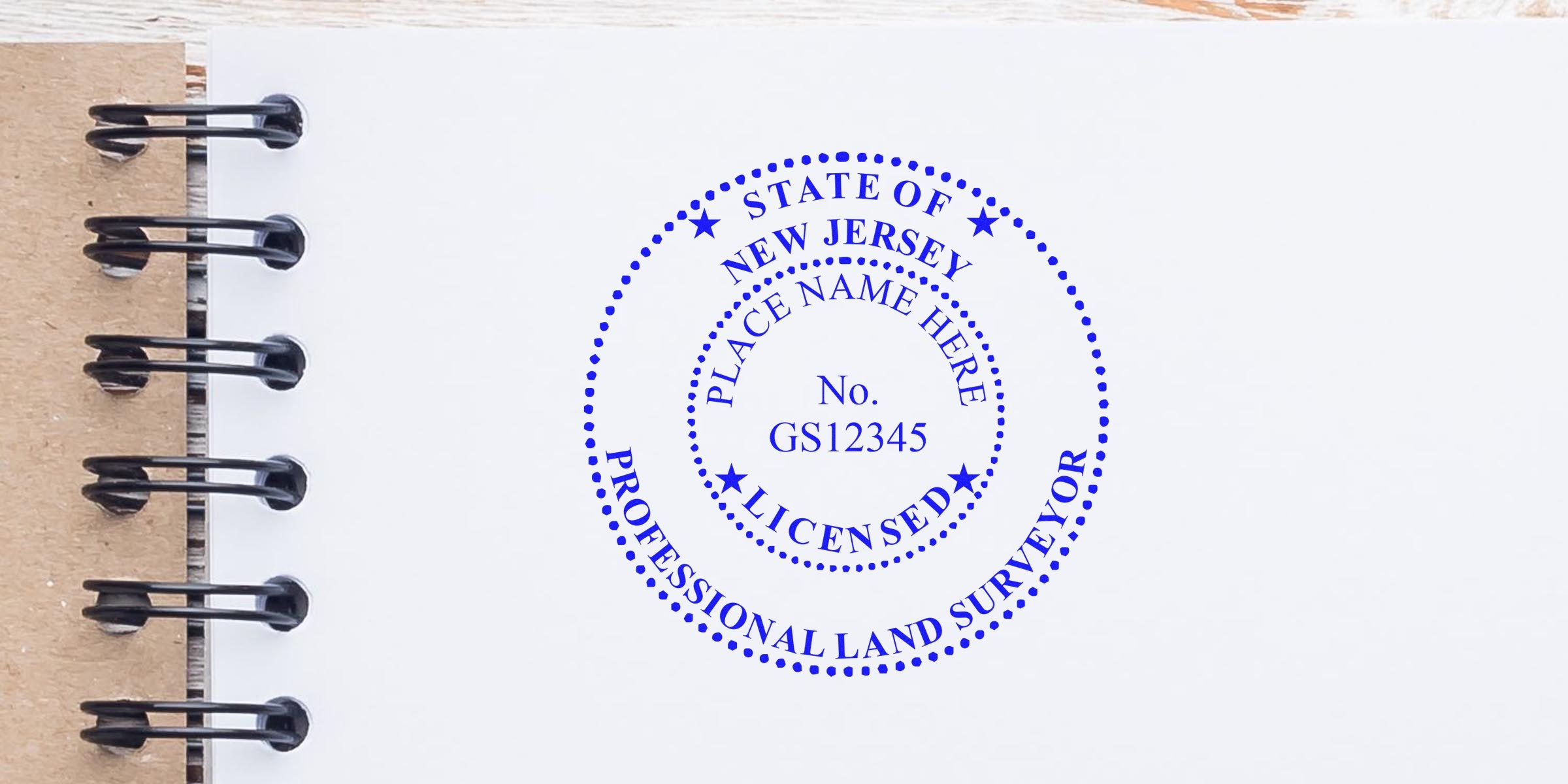 New Jersey land surveyor stamp and licensed professional seal on notebook page, symbolizing NJ land surveyor certification.