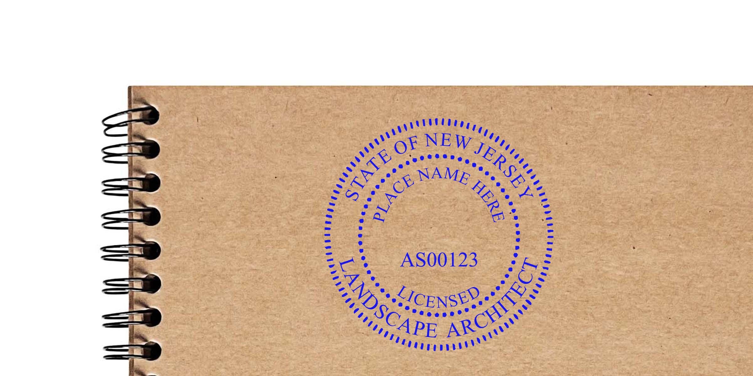 New Jersey landscape architect stamp on brown spiral notebook, displaying the stamp and its requirements.