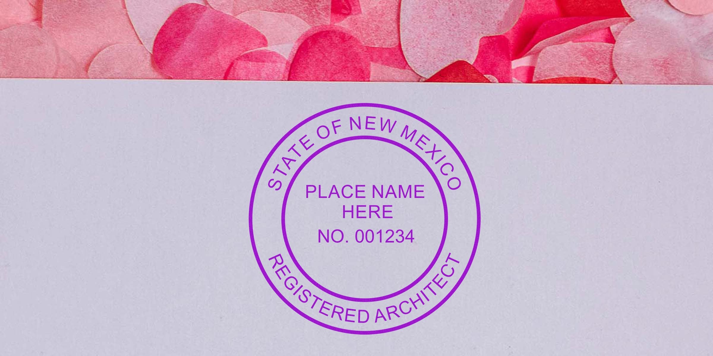 New Mexico architect seal embossed on white paper with pink heart confetti, showing state-registered architect stamp and seal embosser.