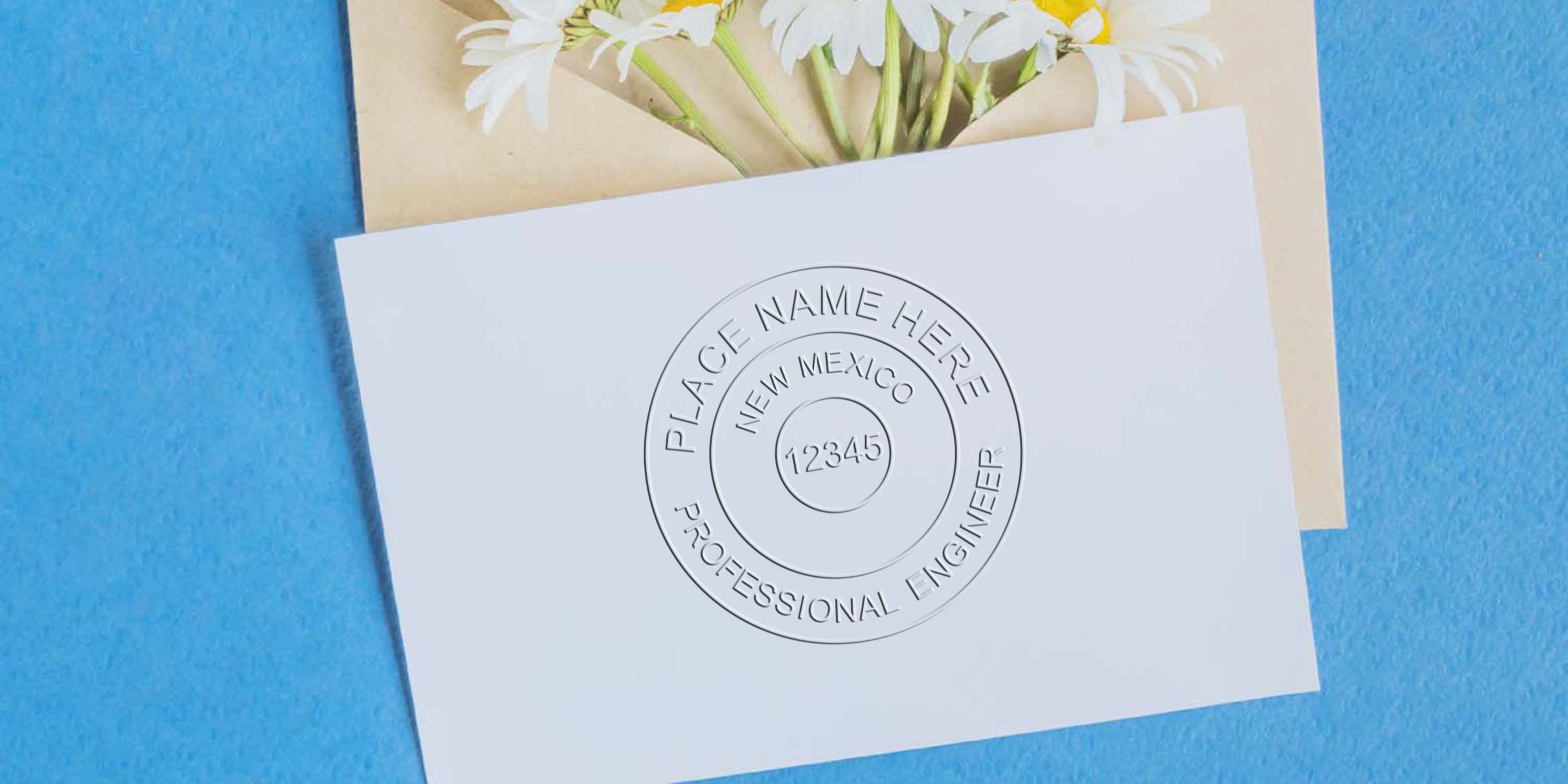 New Mexico PE Seal embossed on white card with flowers and blue background, symbolizing the engineering license of New Mexico.