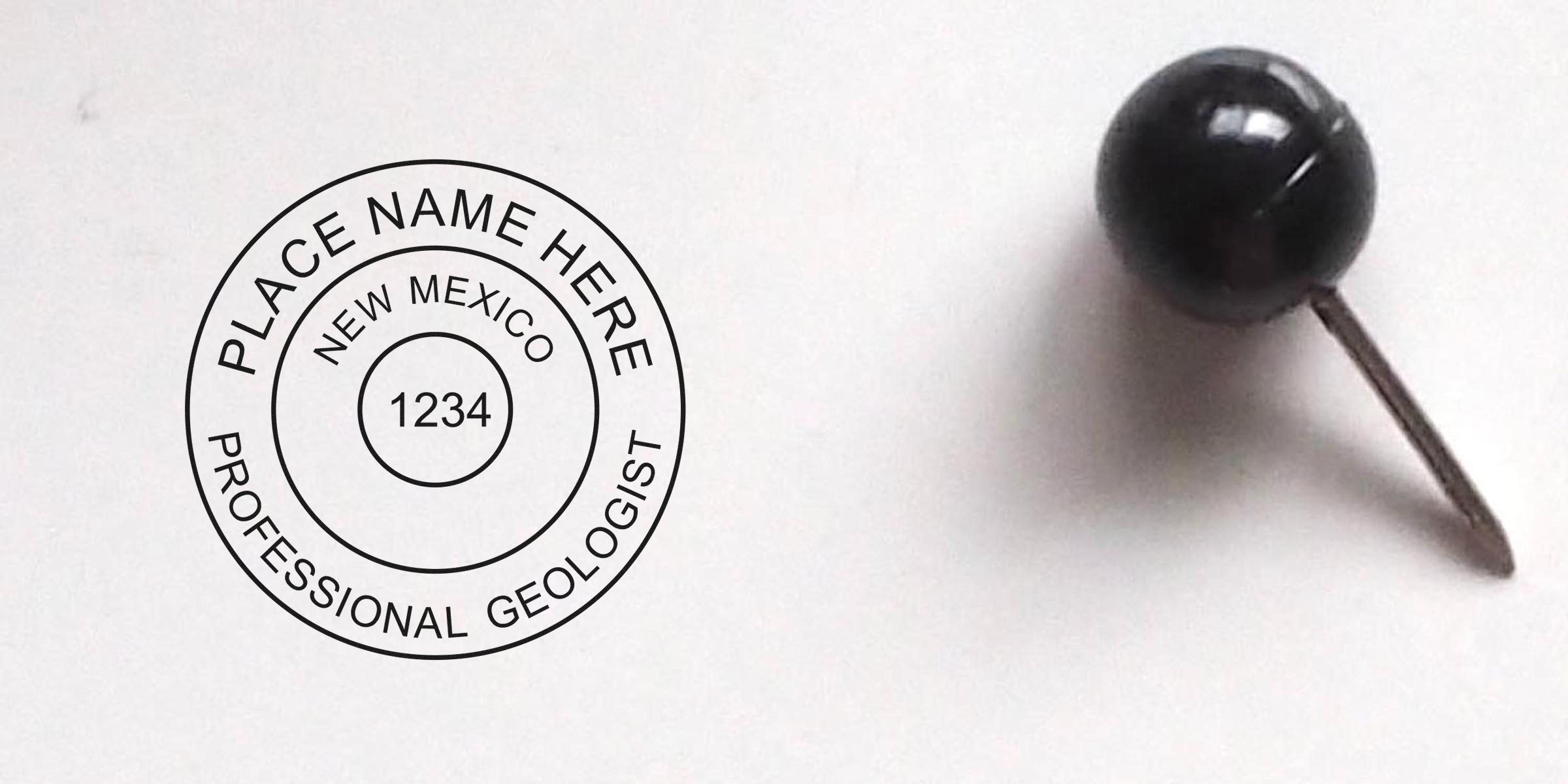 New Mexico Geologist Stamp pinned with a black push pin on a white background, showing the stamp and its requirements.