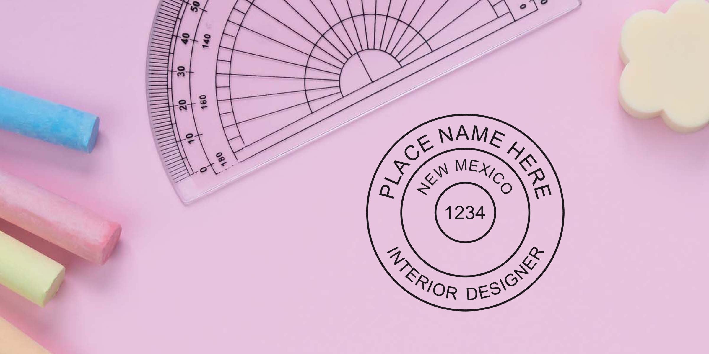 Pink background with pastel chalks, a clear protractor, and a custom rubber stamp design for a New Mexico interior designer.