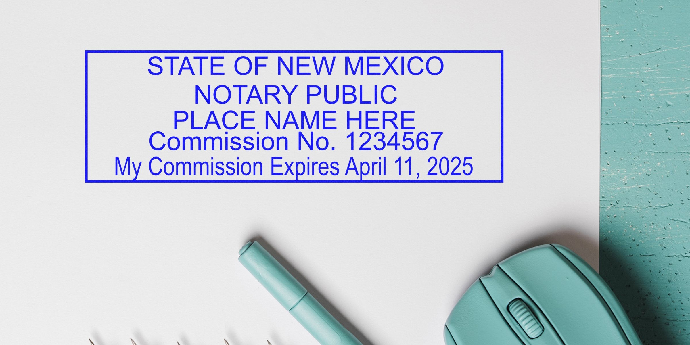 New Mexico notary seal stamp with commission number and expiration date on white paper, next to teal pen and computer mouse, meeting state seal requirements.