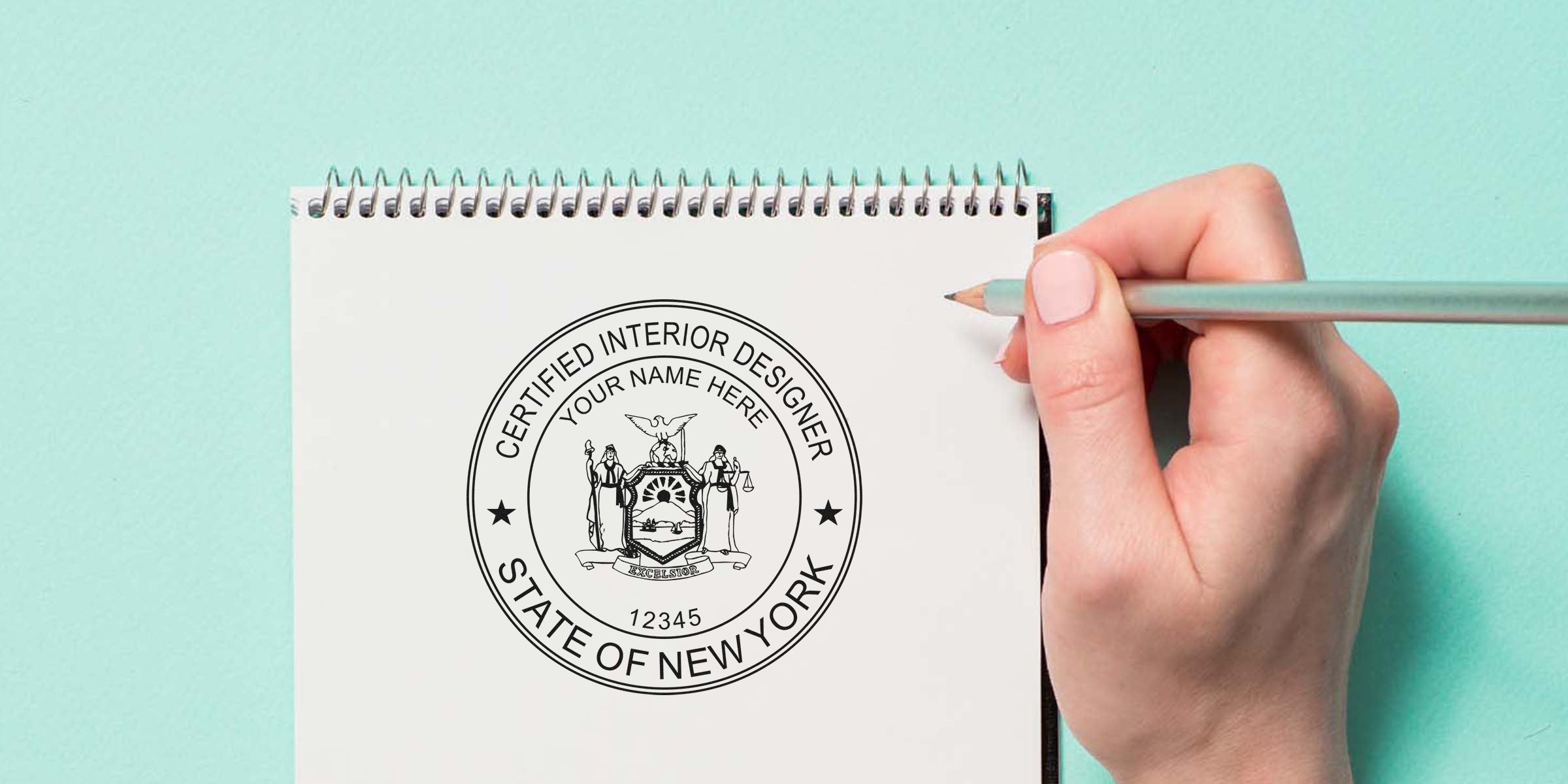 New York interior designer seal on sketchpad, hand holding pencil, crafted by stamp maker.