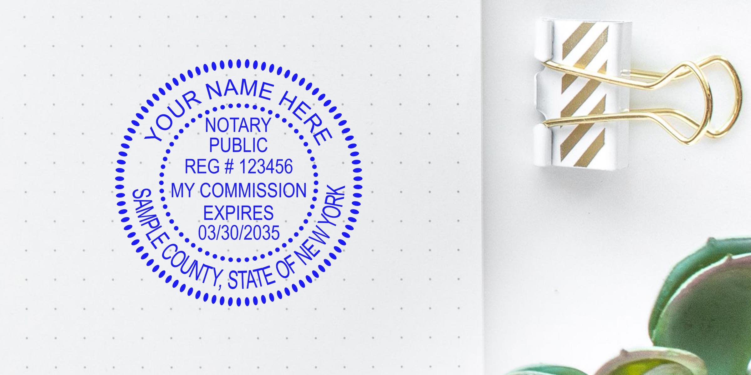 Custom New York Notary Kit stamp on dotted notebook page with gold binder clip and succulent, personalized Notary Supplies New York seal for official documents.
