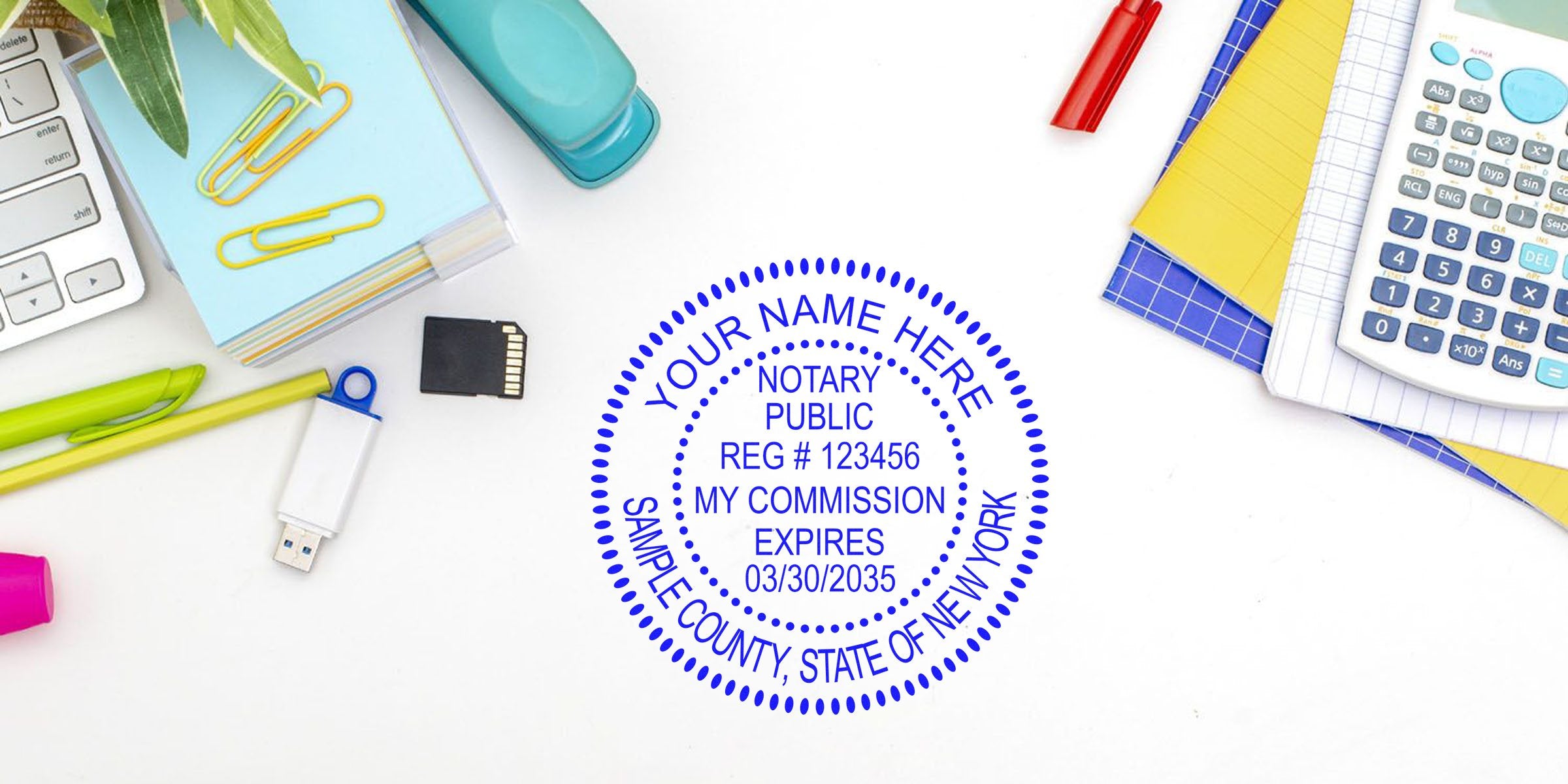 Notary stamp NY on desk with calculator, USB drive, and stationery—perfect for those buying a New York notary stamp for commission renewal.