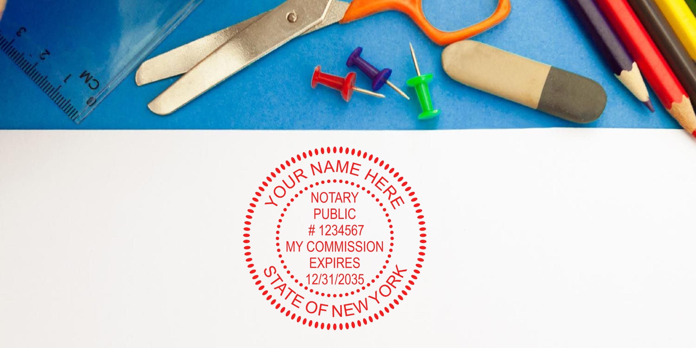 New York notary stamp on white paper with scissors, ruler, eraser, push pins, and colored pencils on a blue background—ideal for anyone seeking to buy a notary stamp in NYC.