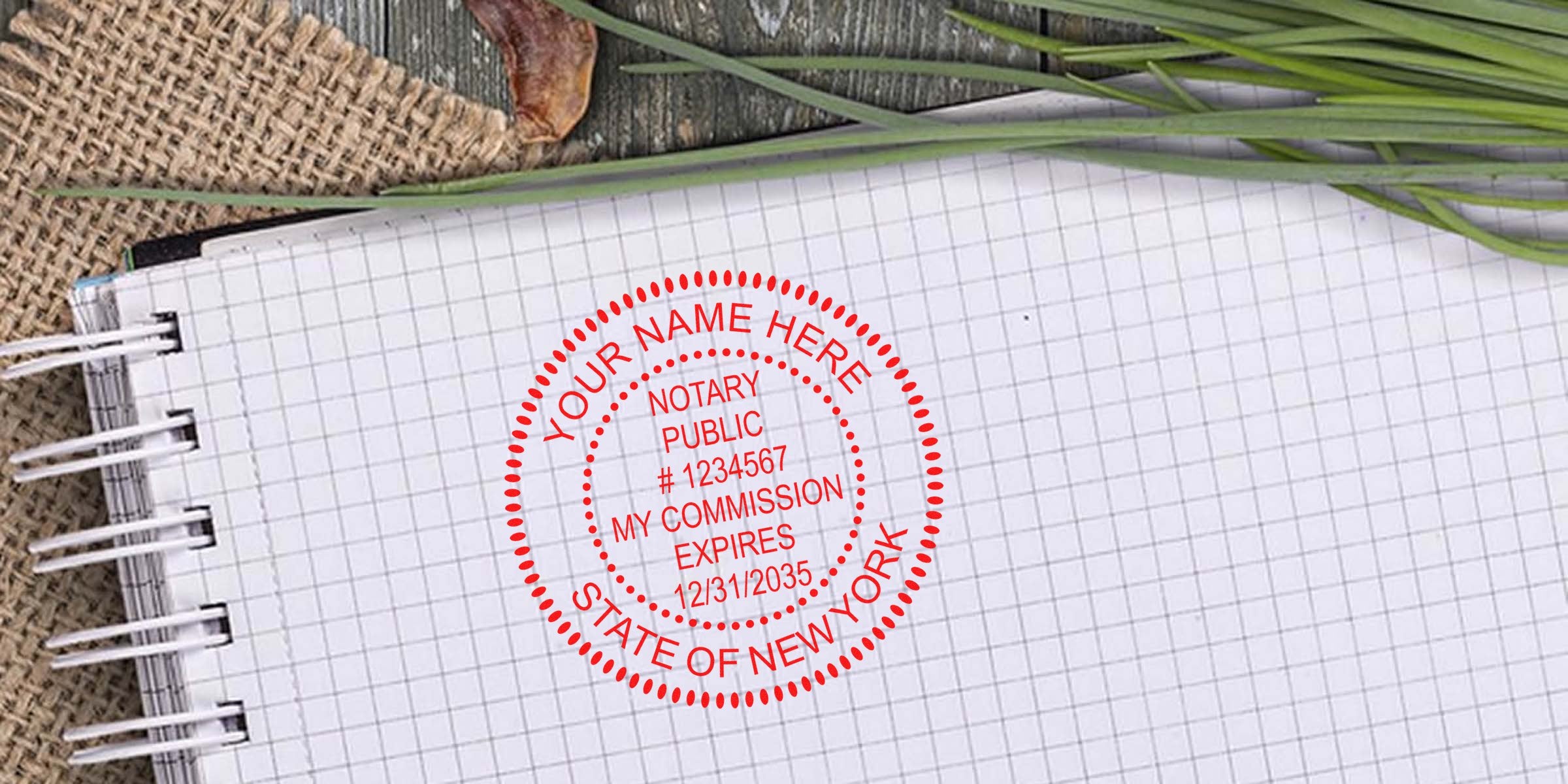 New York notary seal on graph paper notebook showing commission expiration date. Buy custom NY notary stamps.