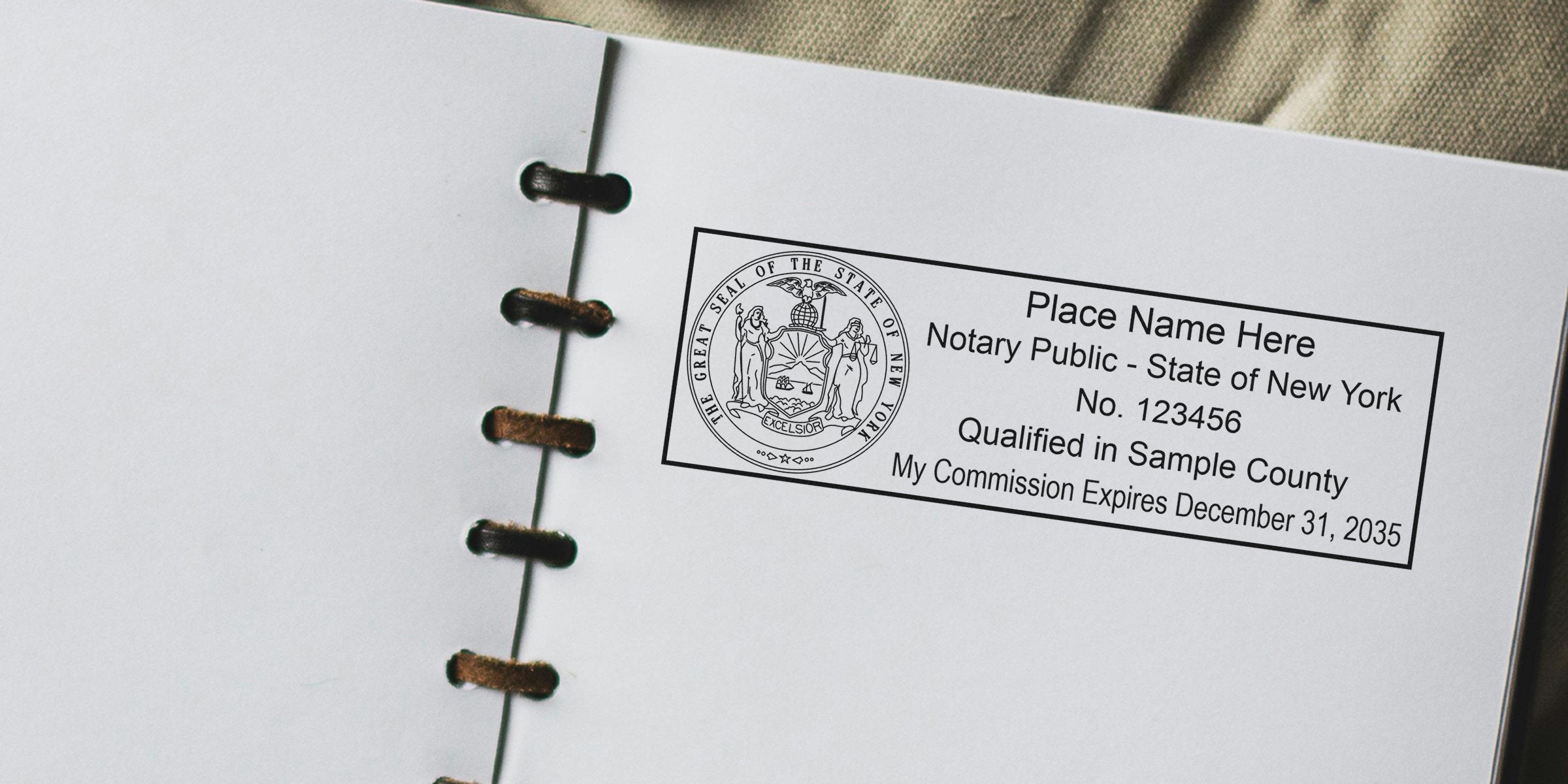 New York notary stamp on state commission certificate in binder with seal and expiration date, part of the notary seal guide.