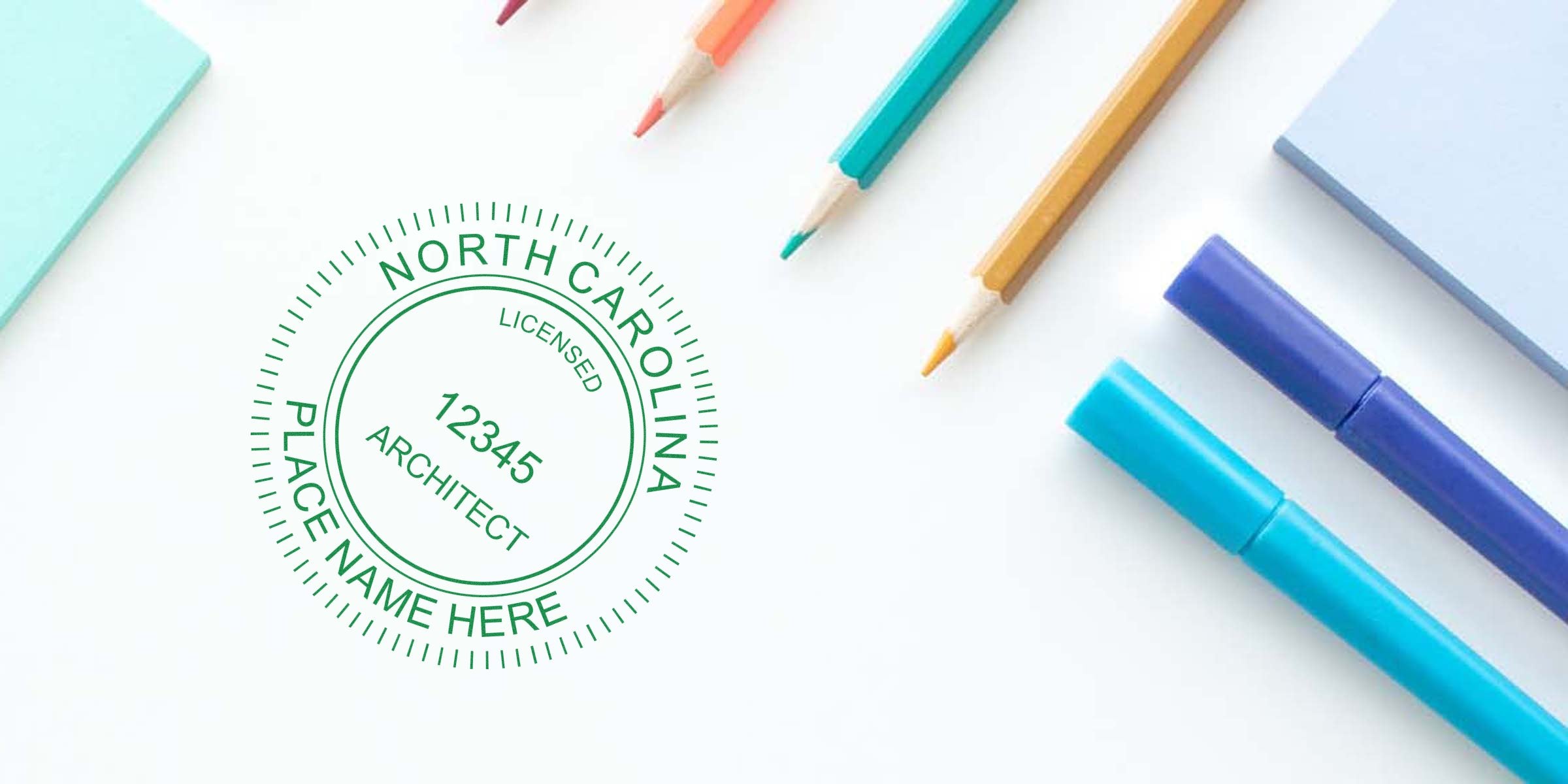 North Carolina architect license stamp on white desk with colored pencils, showing stamp size and meeting NC architect stamp requirements.