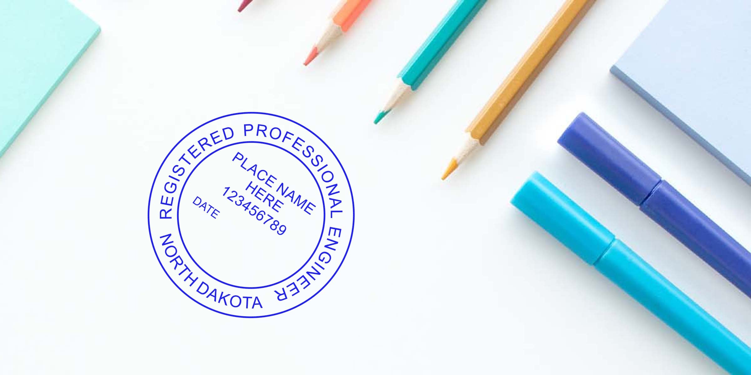 North Dakota Professional Engineer Seal NC stamped on white desk with colorful pencils and markers, showing tips for choosing an engineer seal.