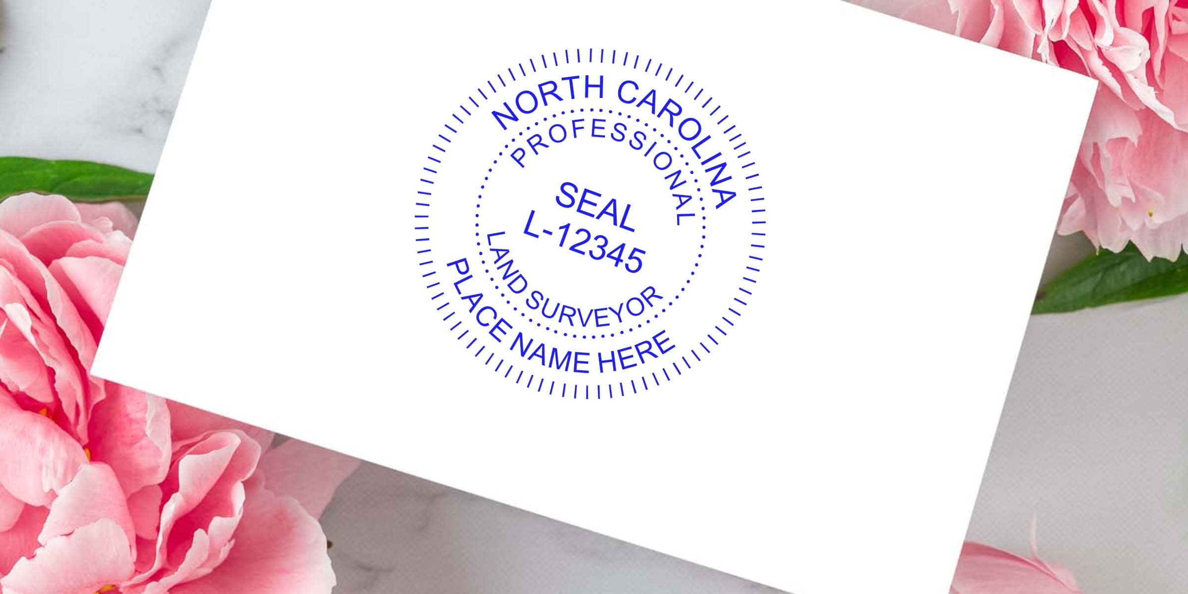 Authentic North Carolina surveyor seal stamped on white paper with a pink flower background.