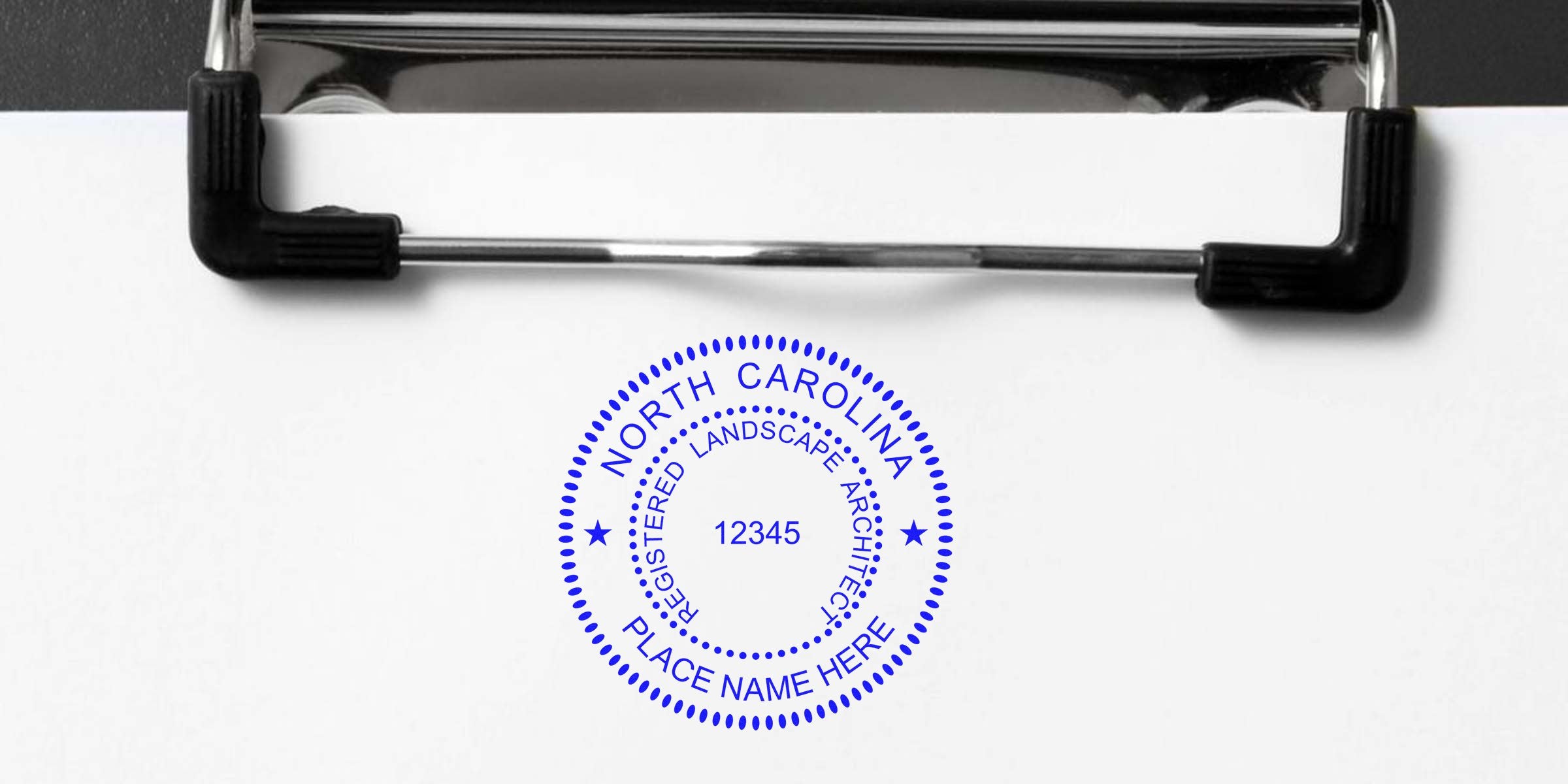 North Carolina landscape architect seal stamped on clipboard, displaying place name and license number per landscape architect seal guidelines.