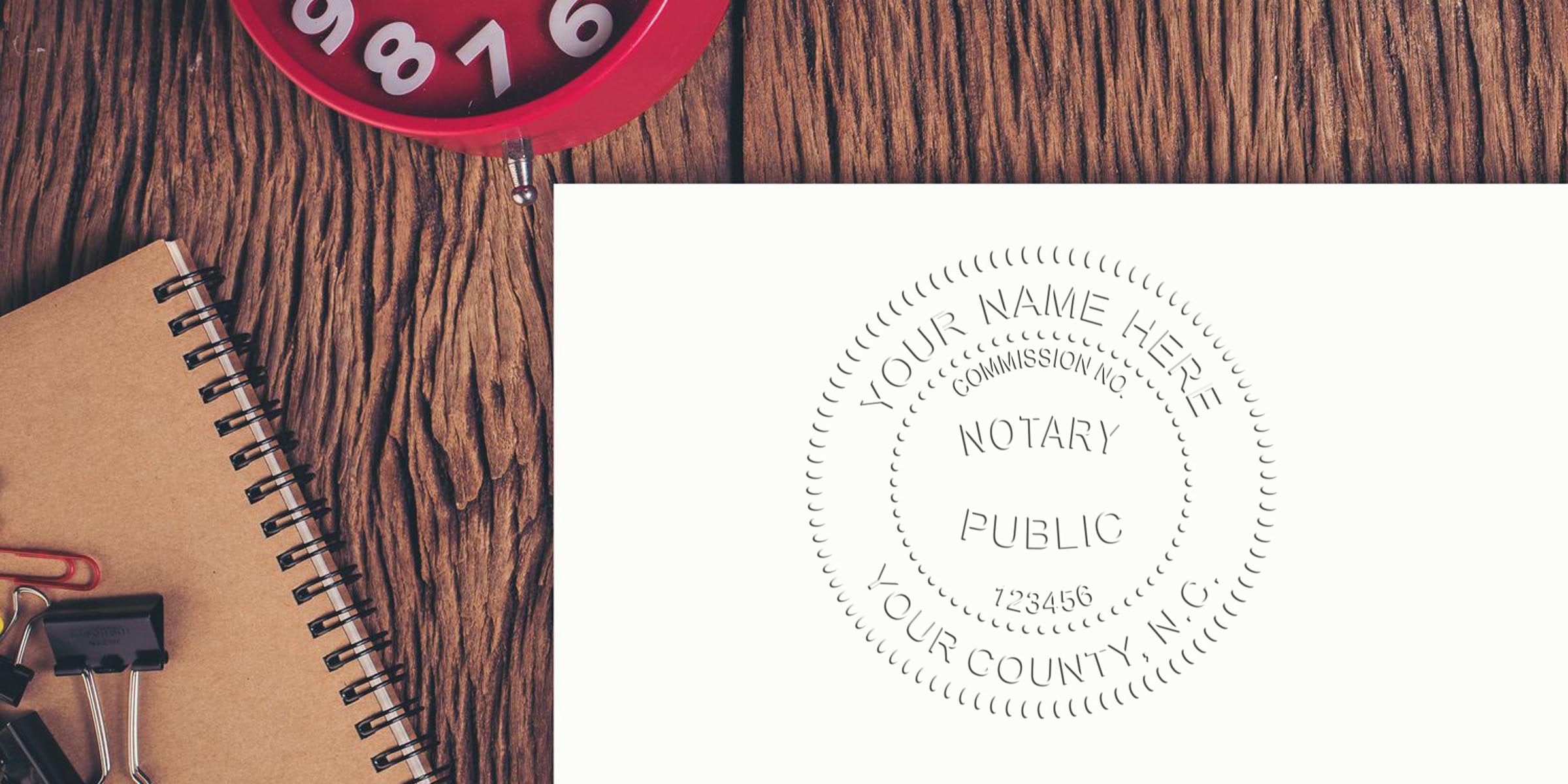 North Carolina notary seal stamped on paper with office supplies and a red clock on a wooden desk, showcasing online notary seal purchase options.
