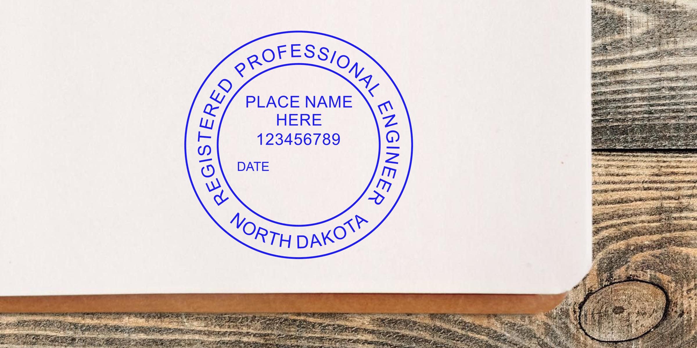 North Dakota Engineer Stamp with ND seal on white paper, wooden background. Buy Engineer Stamps online now.