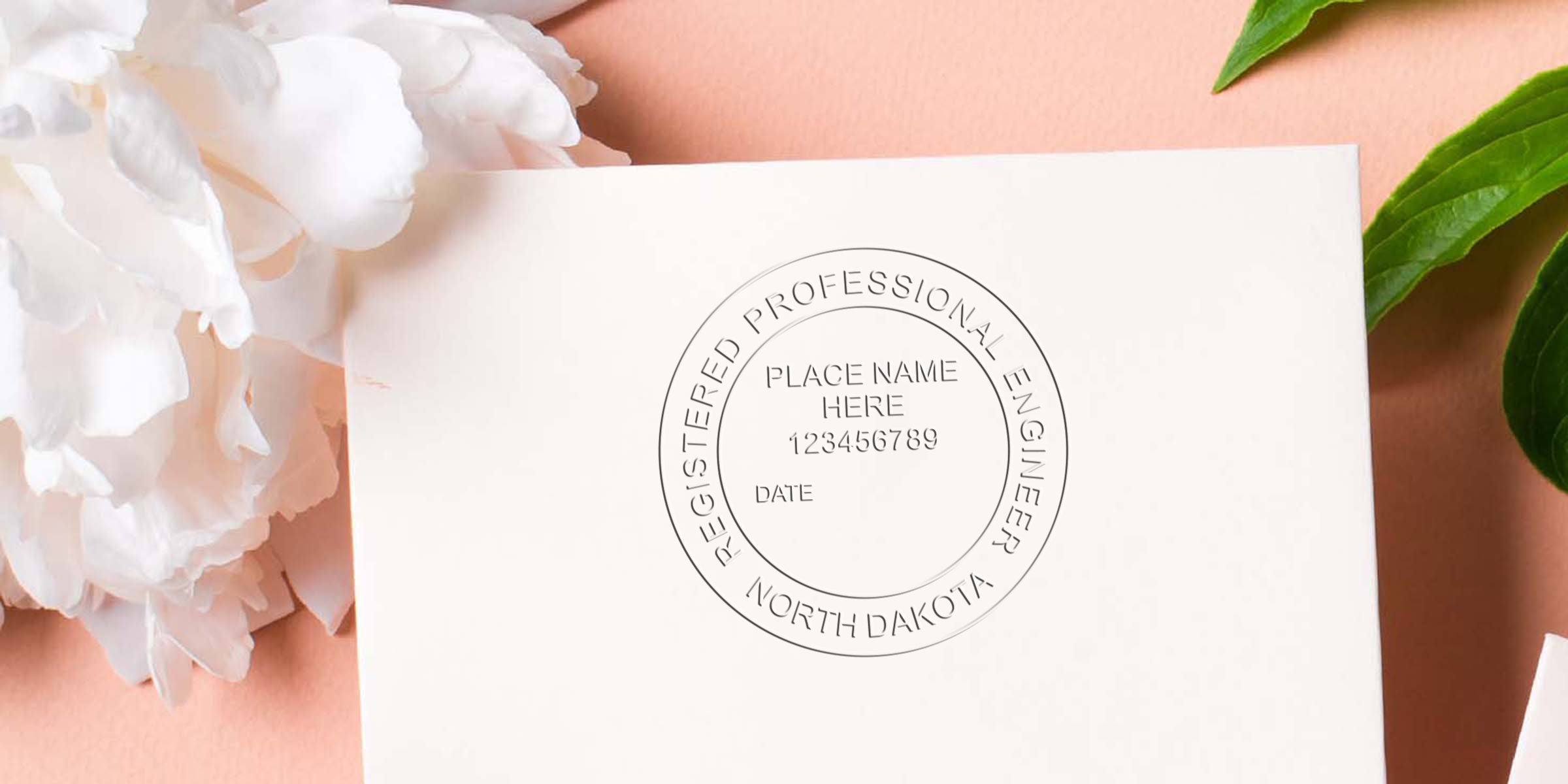 North Dakota Professional Engineer Seal on white paper with white flower and green leaves background, symbolizing North Dakota Engineering License.