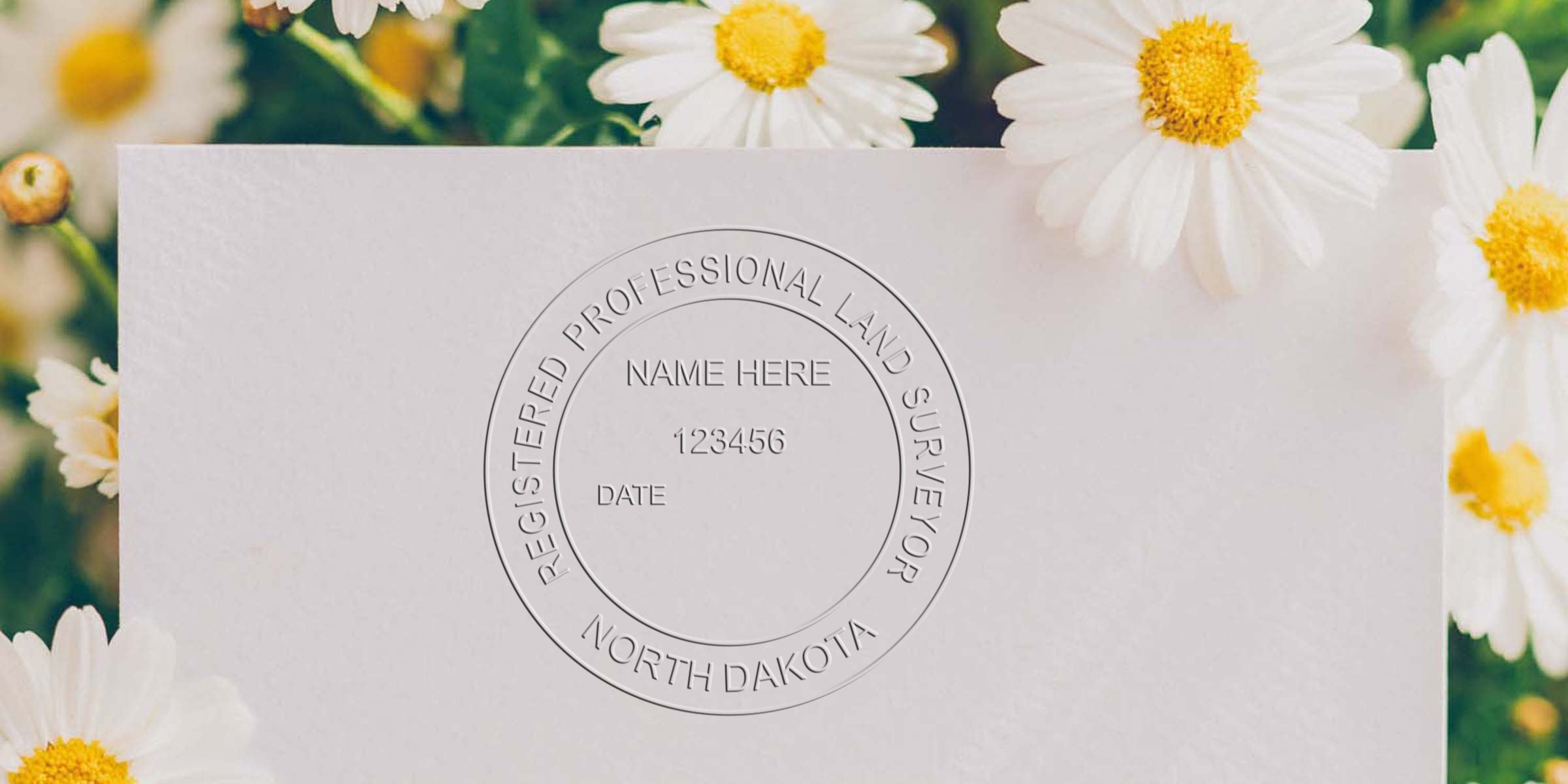Registered professional land surveyor North Dakota embossed seal on white paper with daisies background, showcasing the North Dakota surveyor seal and professional surveyor standards.