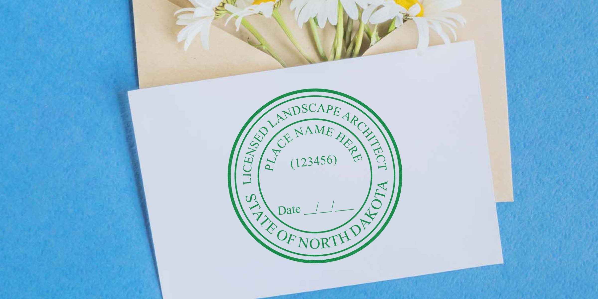North Dakota landscape architect license renewal stamp on white card with flowers against a blue background, emphasizing the renewal of the North Dakota landscape architect license.