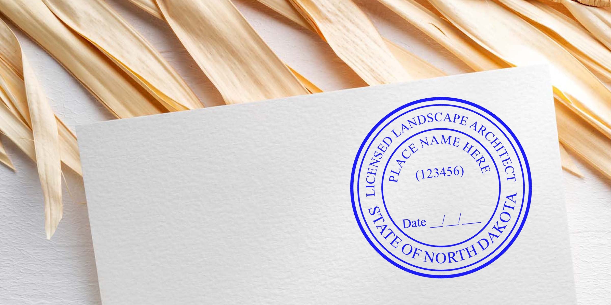 North Dakota licensed landscape architect stamp on white paper with natural wood background, featuring stamp cost and budget-friendly landscape architect tips.