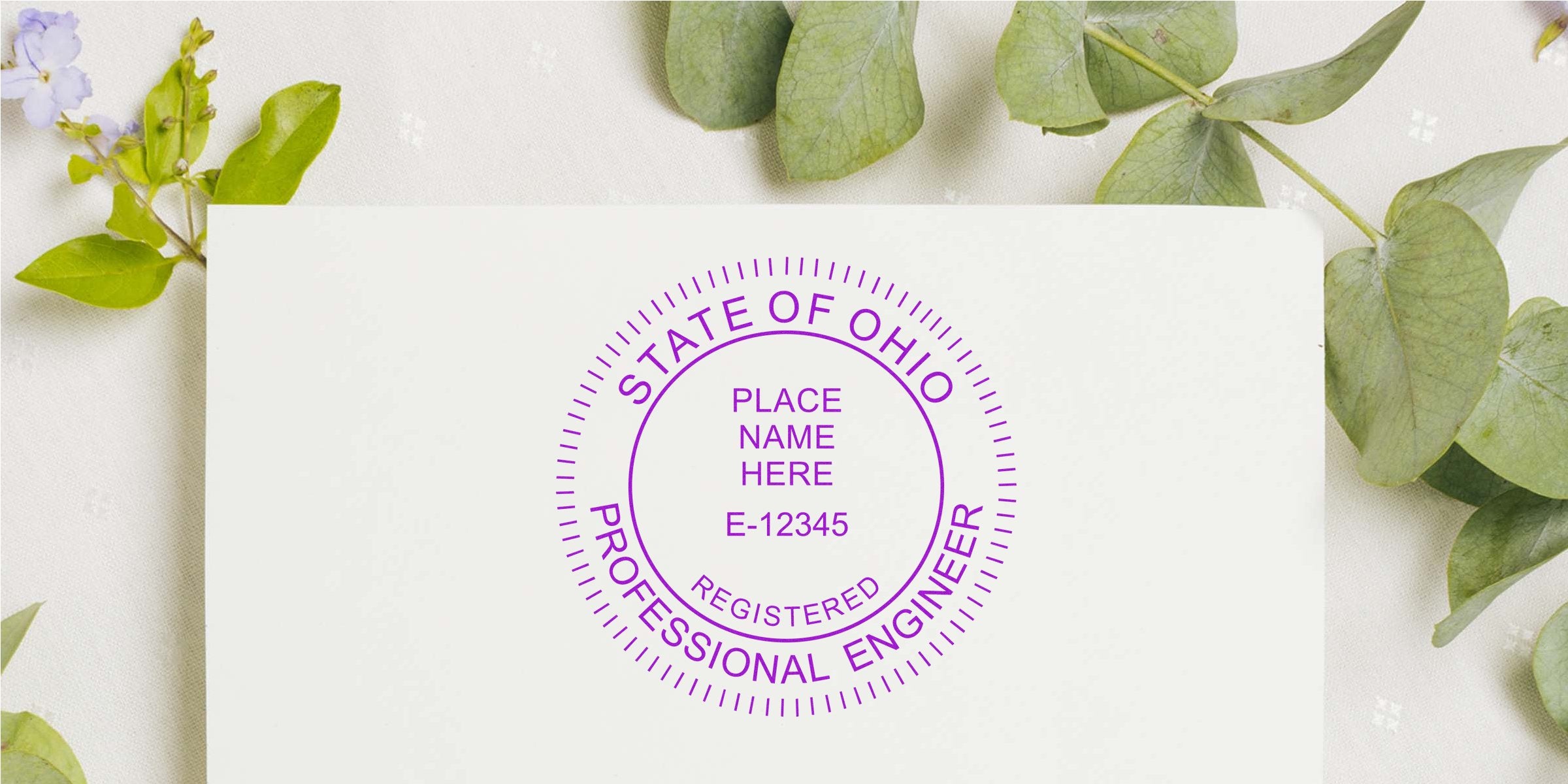 Ohio professional engineer seal on white paper, surrounded by green leaves, featuring custom Ohio engineering stamp design.