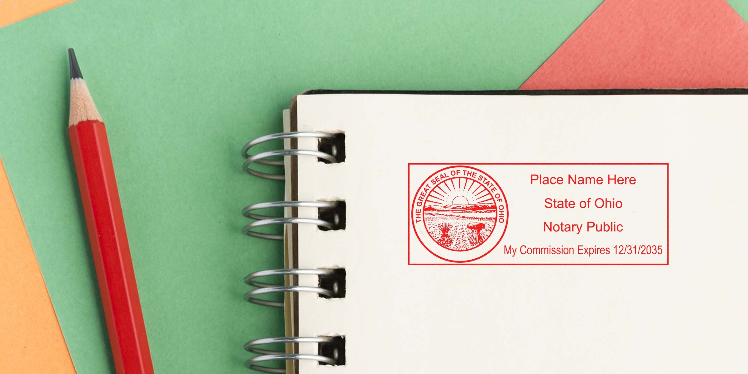 Ohio notary public stamp on notebook with red pencil, part of a full Ohio notary kit on a colorful background.