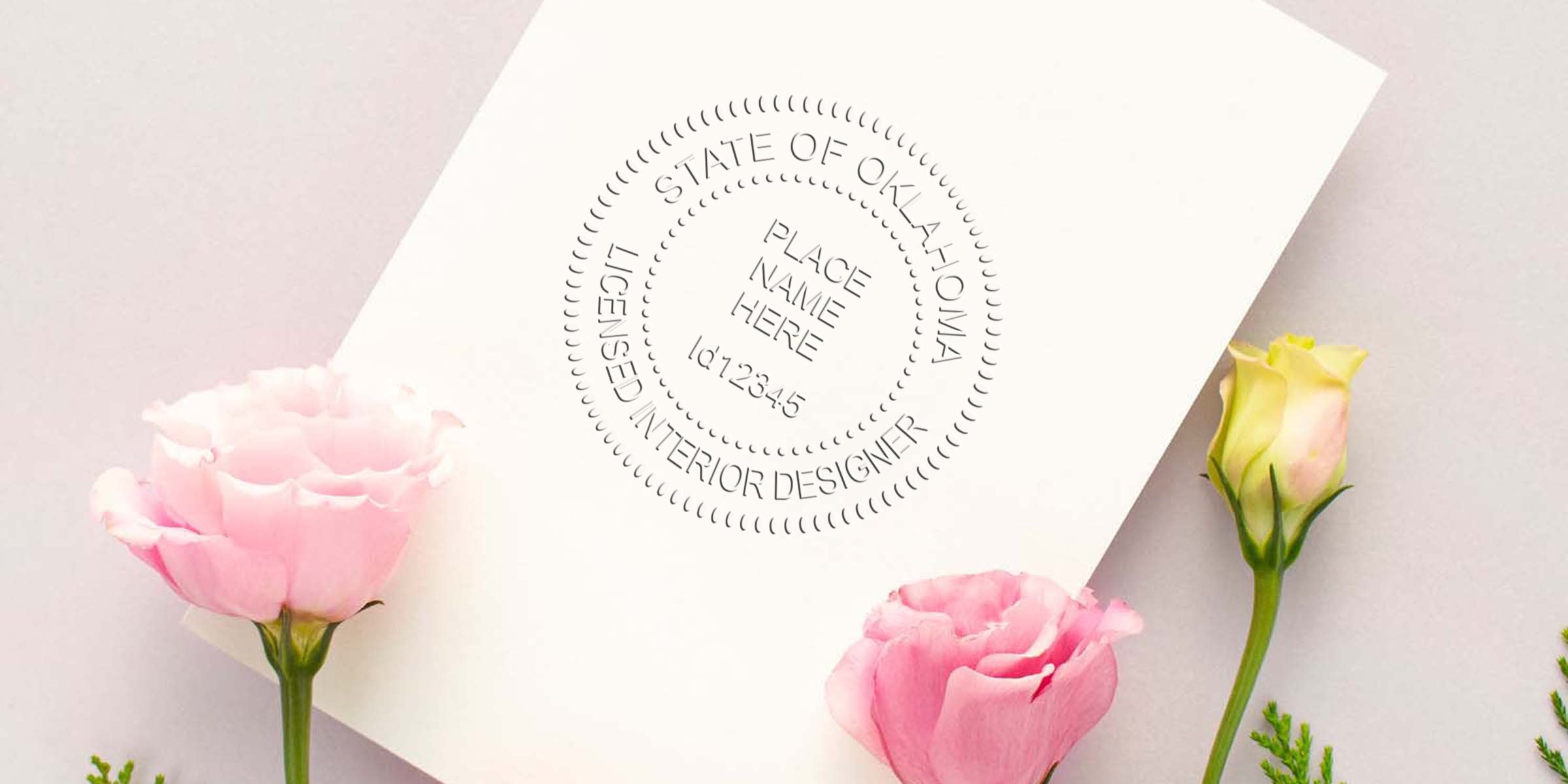 Oklahoma interior designer stamp embossed on white paper with pink and yellow flowers, symbolizing interior design licensing in Oklahoma.