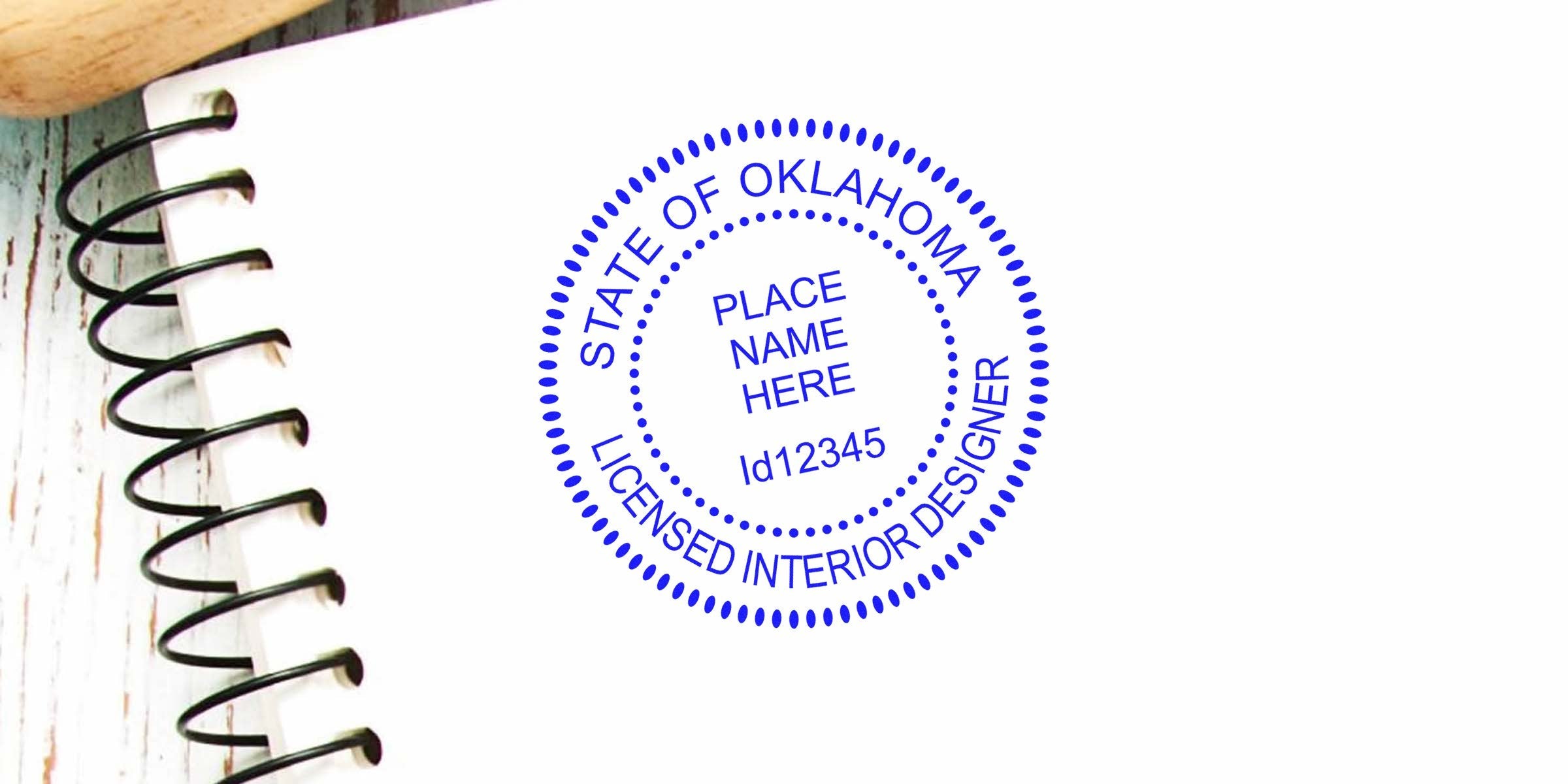 Oklahoma Interior Designer stamp on a white spiral notebook, symbolizing Oklahoma Interior Design Certification and professional credentials.