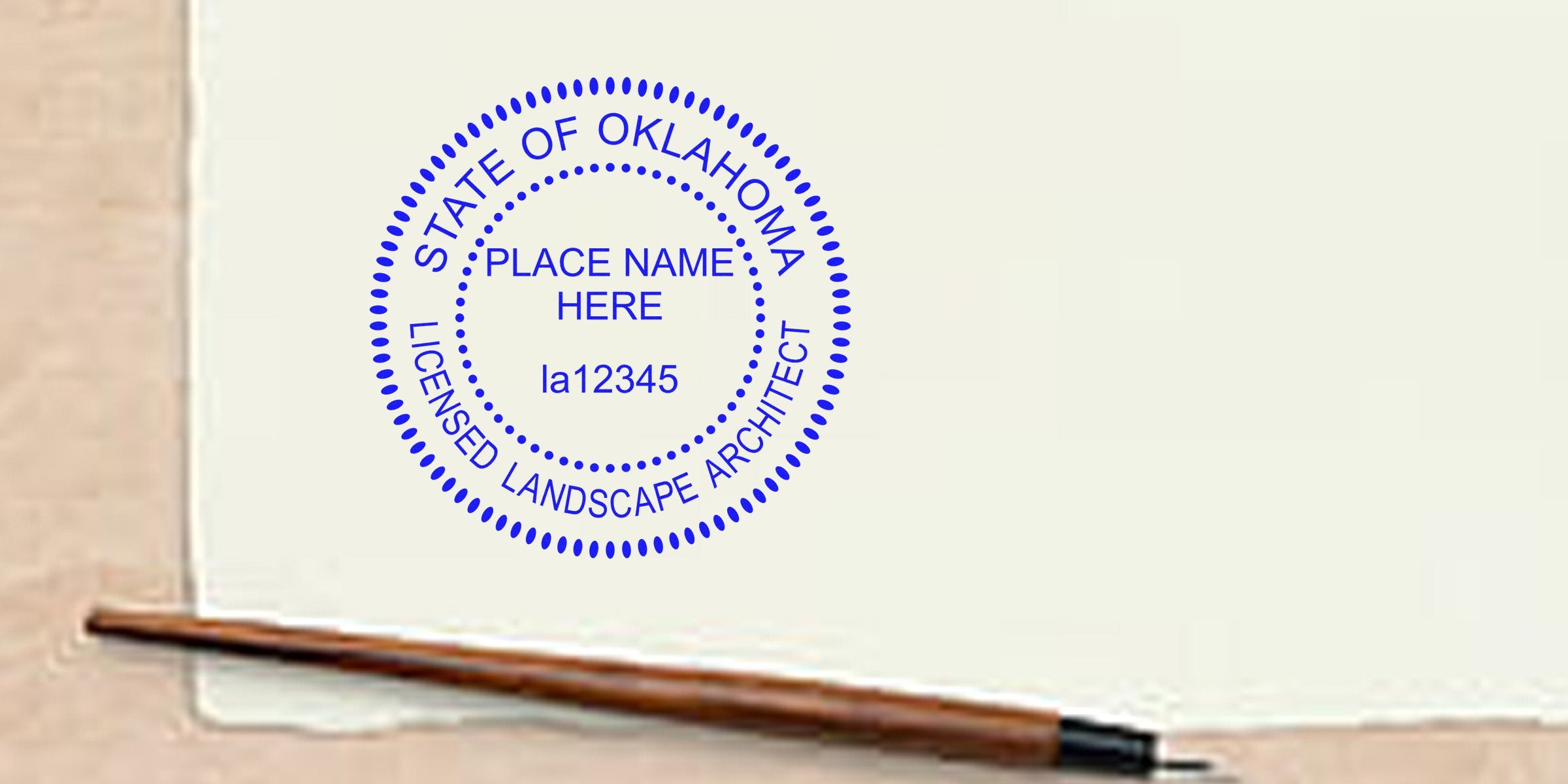 Oklahoma licensed landscape architect stamp on paper with pen, showing the stamp and Oklahoma embossers.