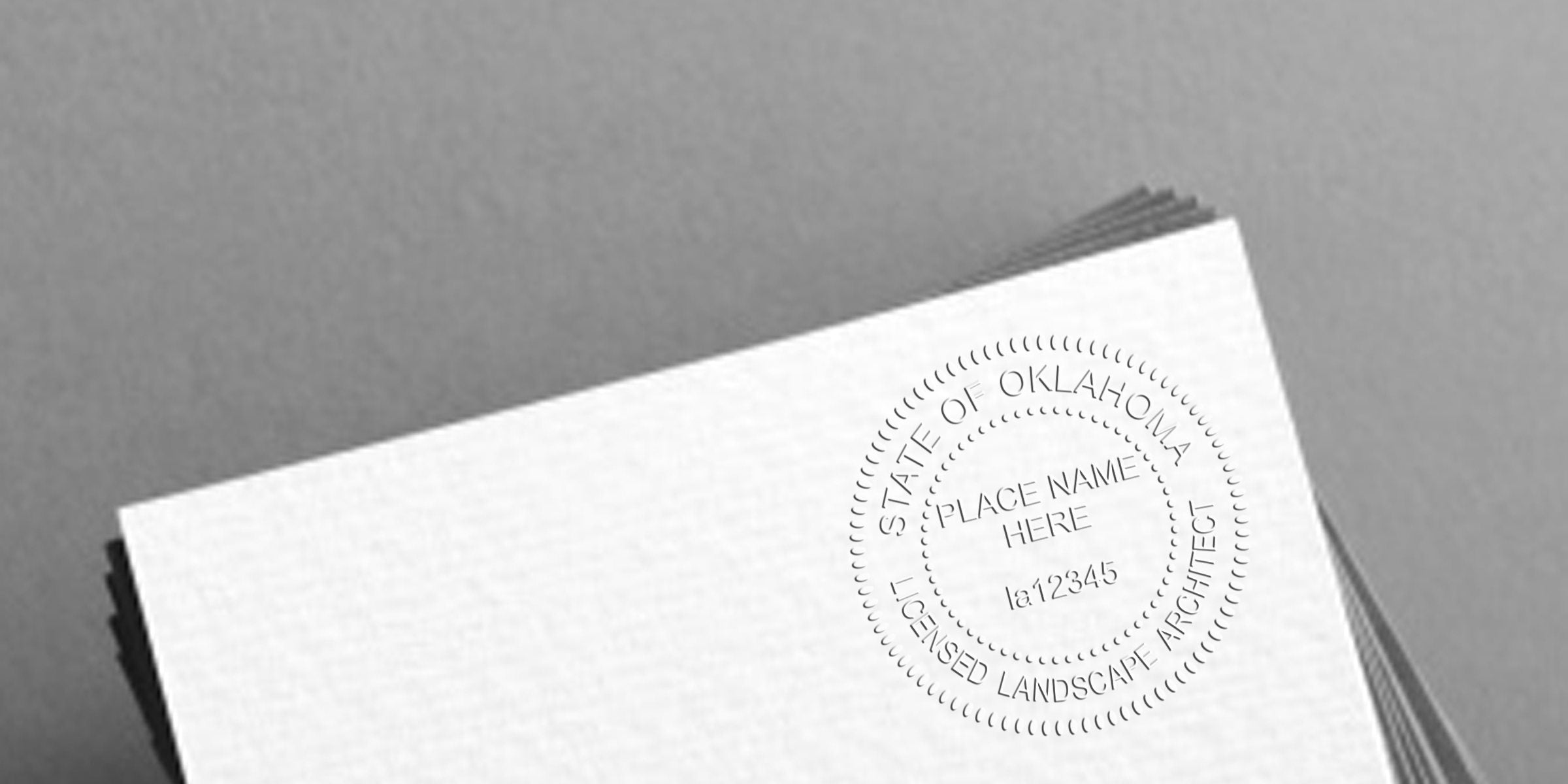 Oklahoma Landscape Architect Seal embossed on white paper with licensed landscape architect seal and seal tips.
