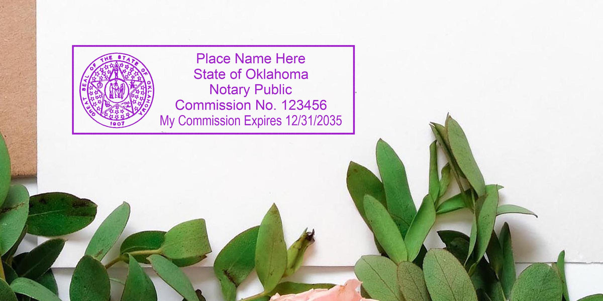 Oklahoma notary public stamp on white paper, decorated with green leaves and a pink flower, displaying the Oklahoma notary stamp format and sample.