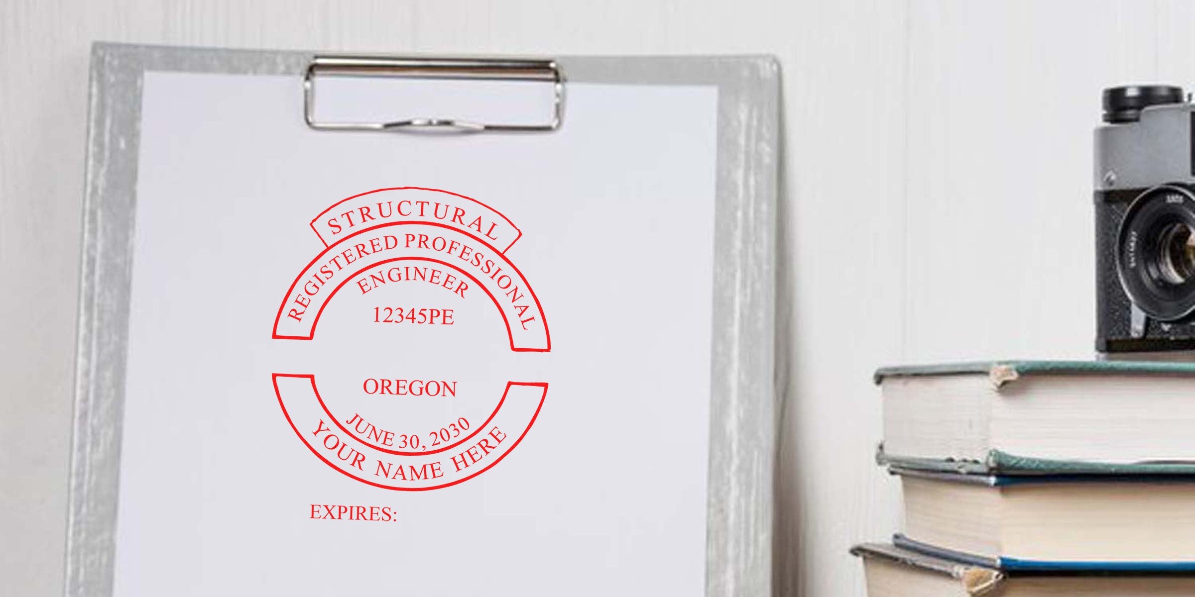 Oregon Engineer Stamp, self-inking on clipboard paper with camera and books, professional structural engineer seal for Oregon license verification.