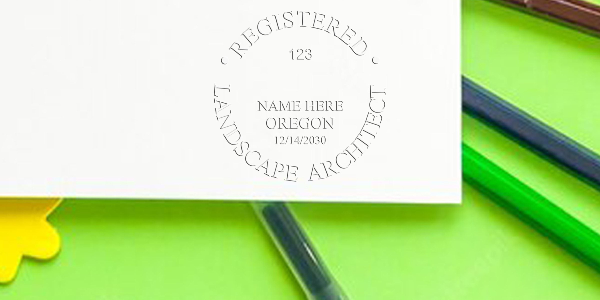 Oregon landscape architect seal stamped on white paper with green and yellow background, representing professional certification in landscape architecture in Oregon.