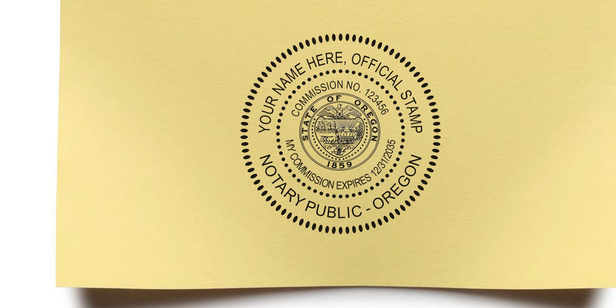Oregon notary stamp on yellow paper with a self-inking stamp showing commission number and expiration date.