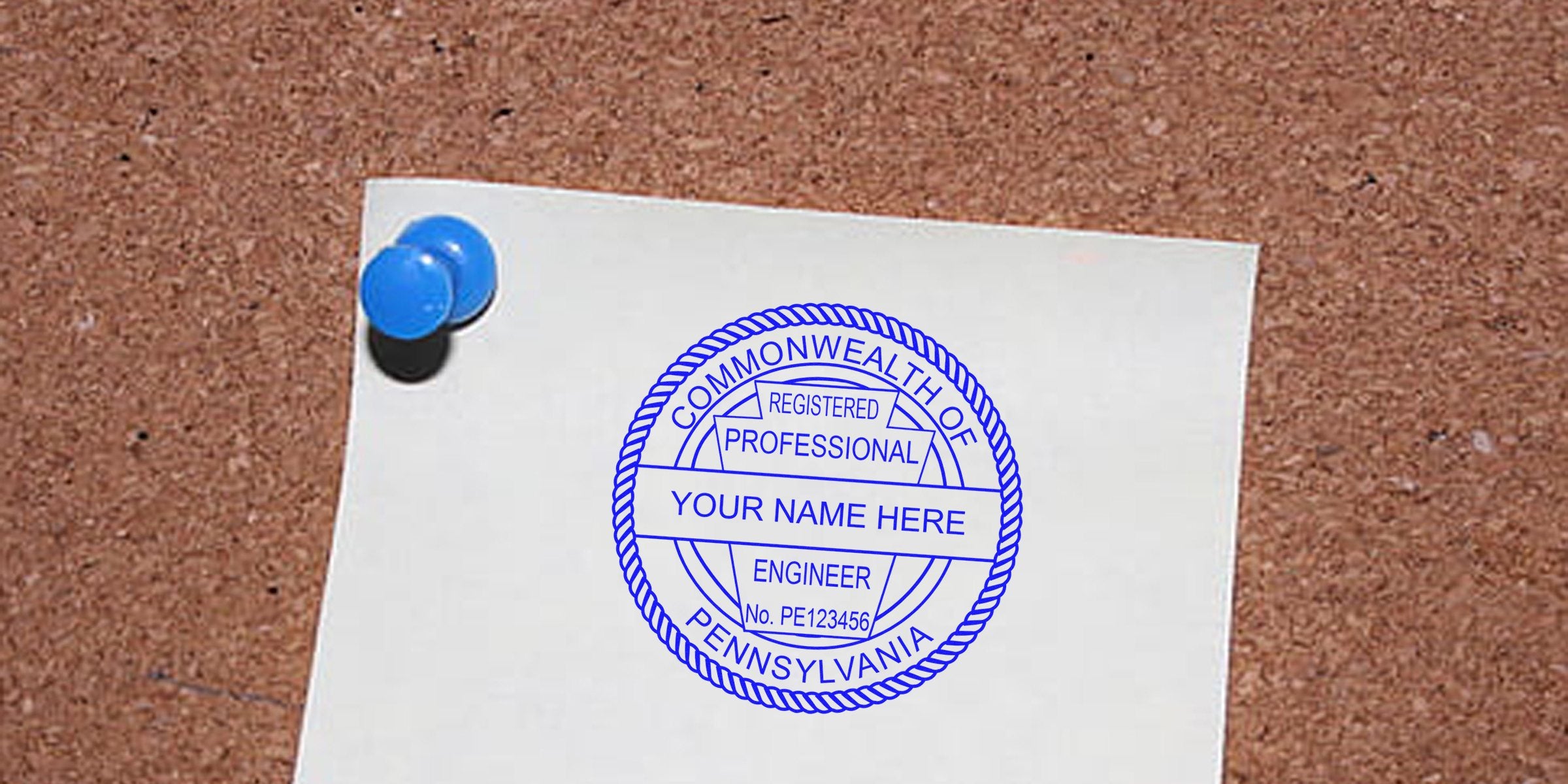 Pennsylvania engineer seal stamp on white paper pinned to corkboard, meeting all Pennsylvania engineer seal standards.