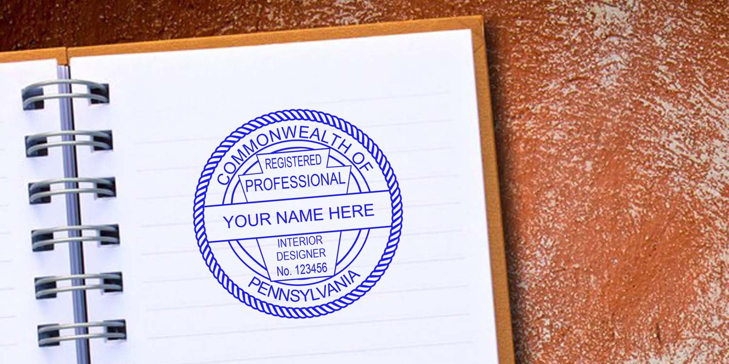 Pennsylvania interior designer seal stamped on a notebook page, following official interior design seal guidelines.