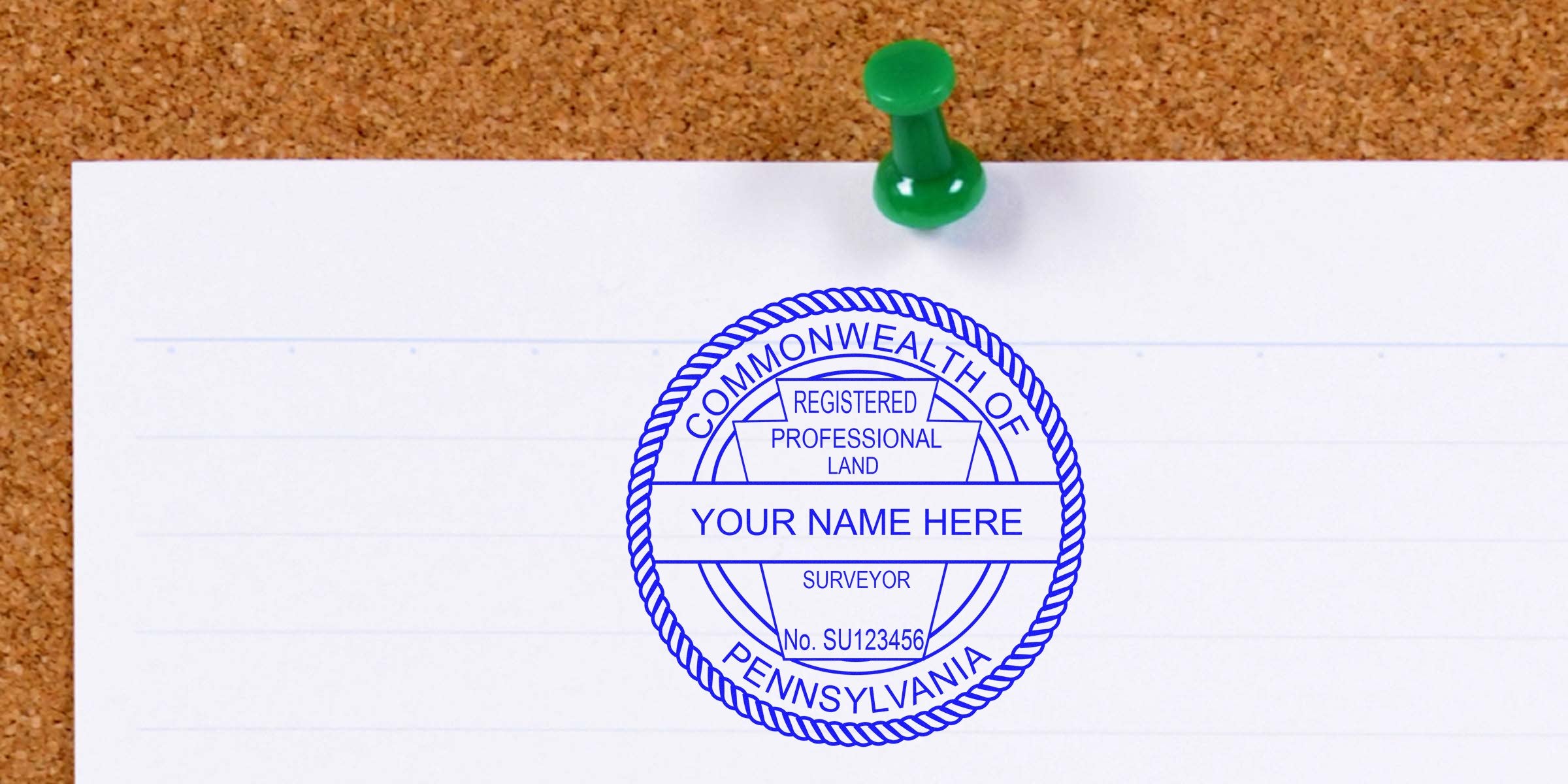 Pennsylvania land surveyor seal pinned on corkboard with a green pushpin, displaying official land surveyor seal details.