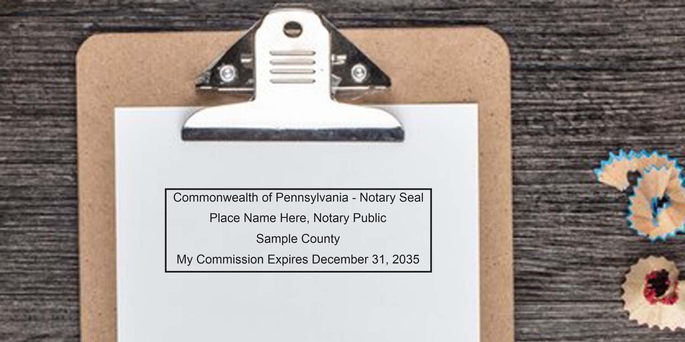 Pennsylvania notary stamp on clipboard showing commission expiration date, pencil shavings on wooden desk, and nearby notary supplies for purchase.