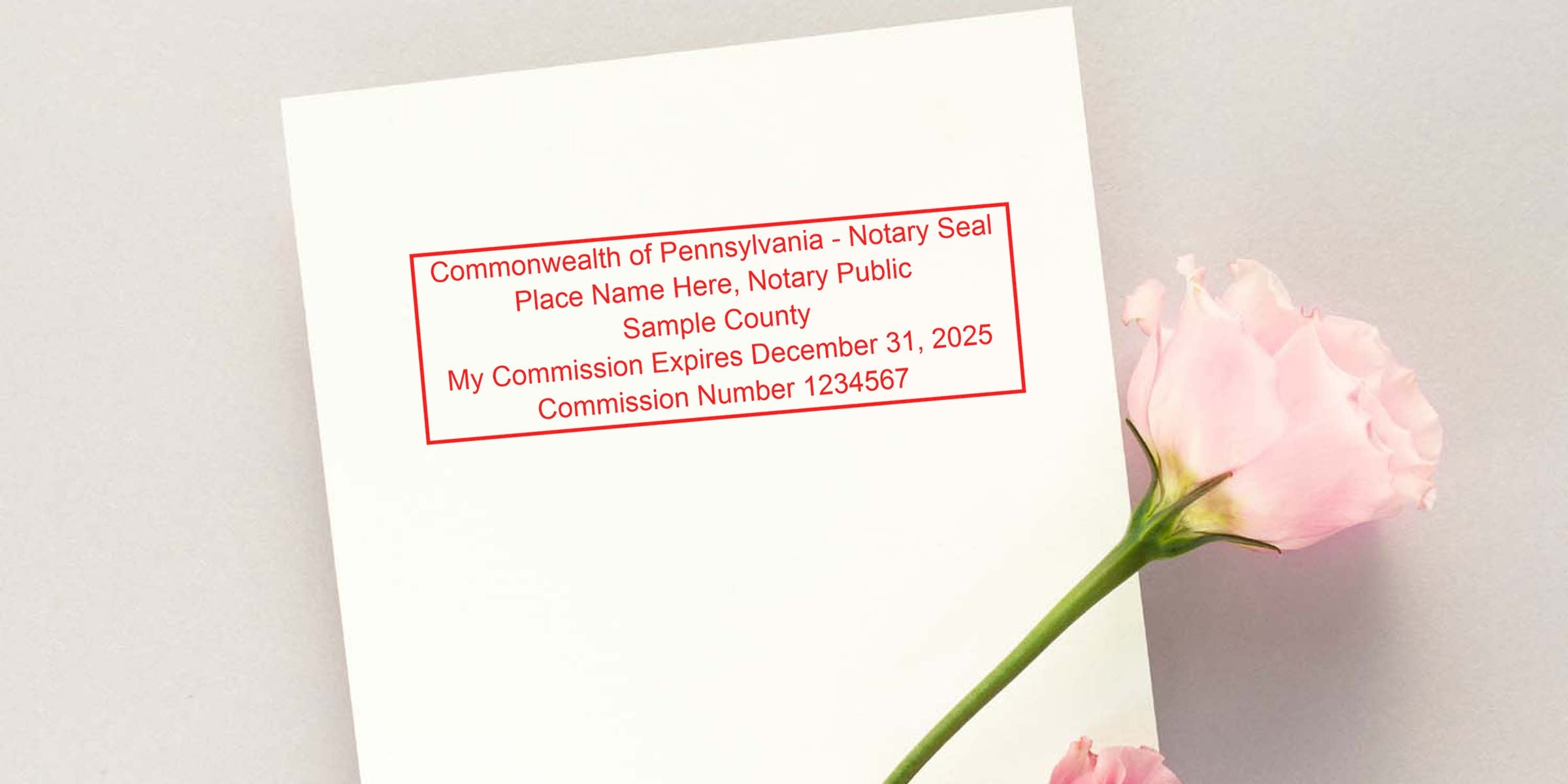 Pennsylvania notary stamp renewal with official seal on white paper, pink rose beside notary public commission expiration date, plus helpful notary renewal tips included.