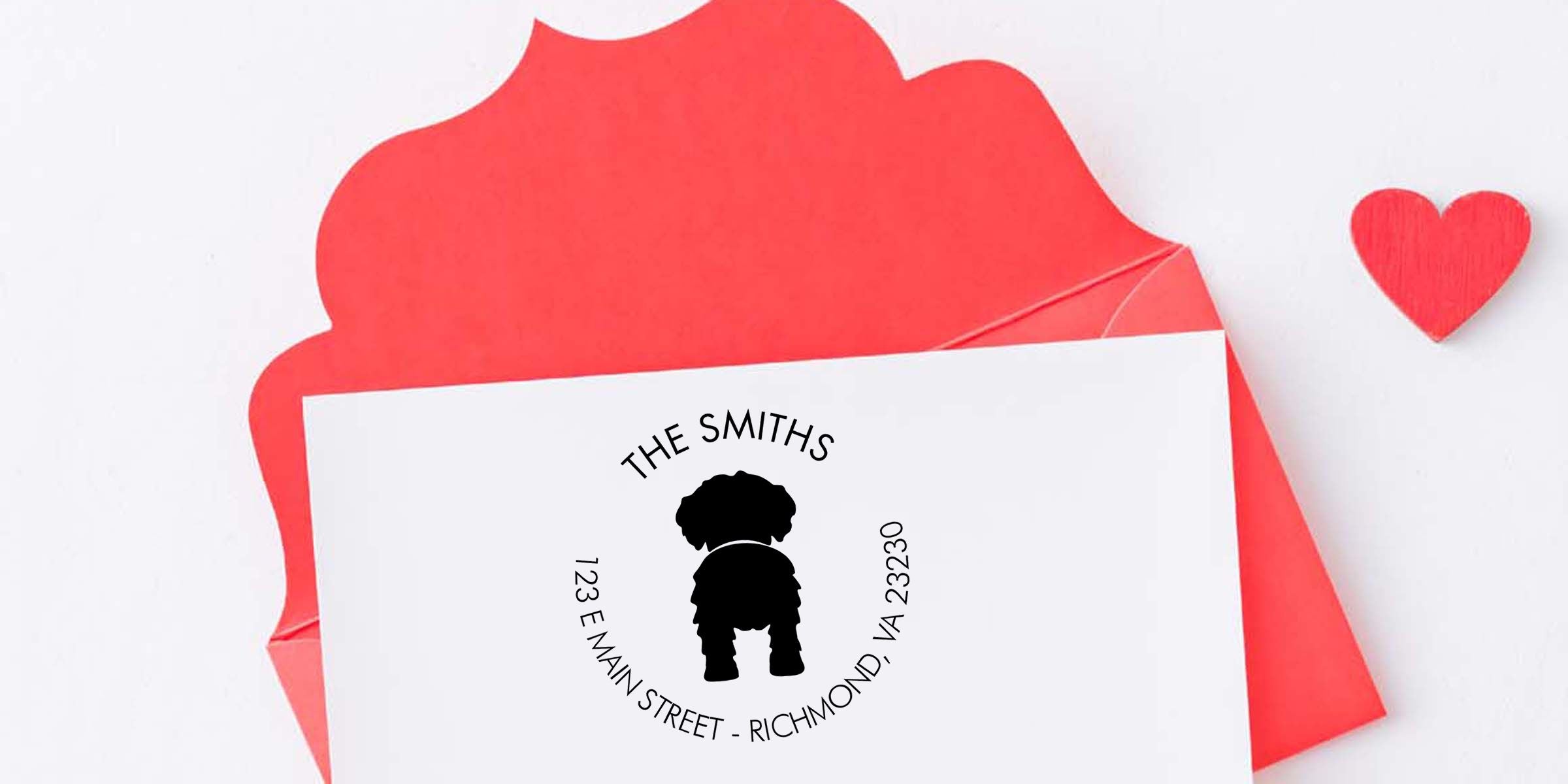 Personalized dog-themed stationery card with red envelope, custom pet logo, The Smiths address, and small red heart on a white background