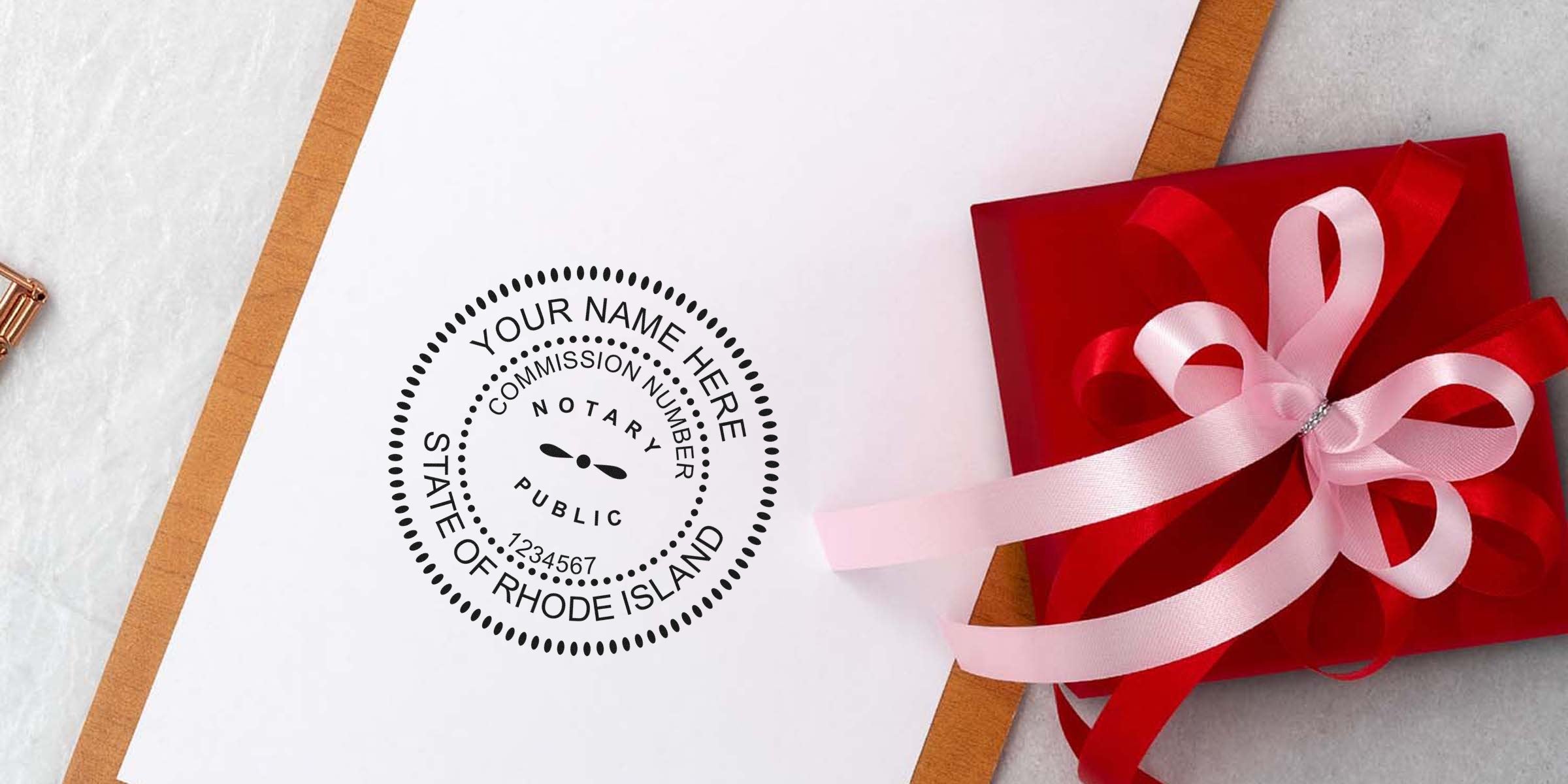 Rhode Island notary seal on white paper beside a red gift box with pink ribbon, featuring a custom notary stamp available online.