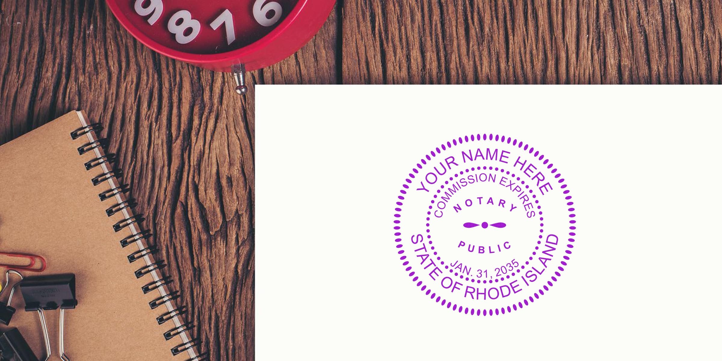 Notary Stamp Rhode Island on white paper with wooden desk, notebook, and red clock, featured in the Rhode Island Notary Guide.