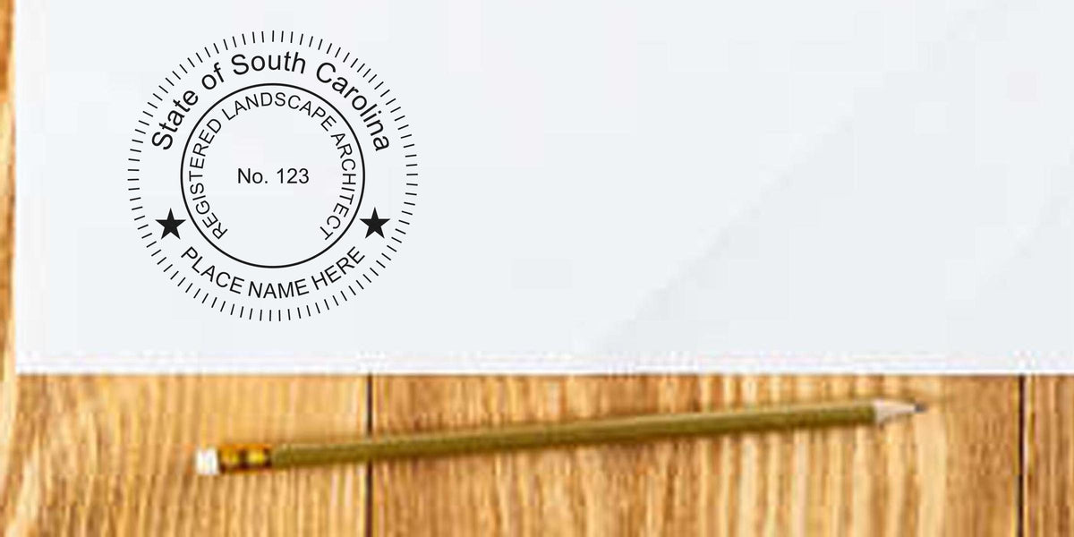 Seal of South Carolina registered landscape architect on document with pencil on wooden table, emphasizing SC landscape architect rules and stamp requirements.