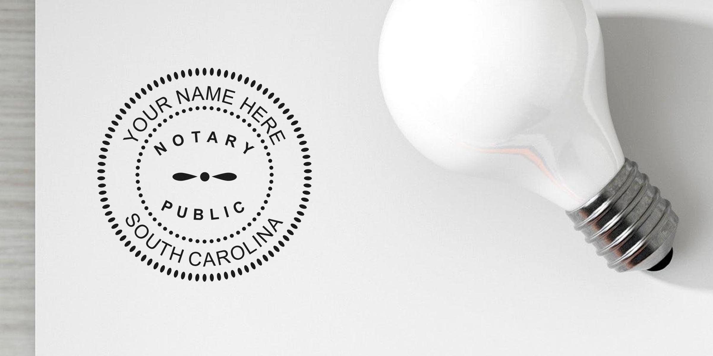 South Carolina notary seal custom stamp beside a light bulb on white background, ideal spot to purchase notary supplies.