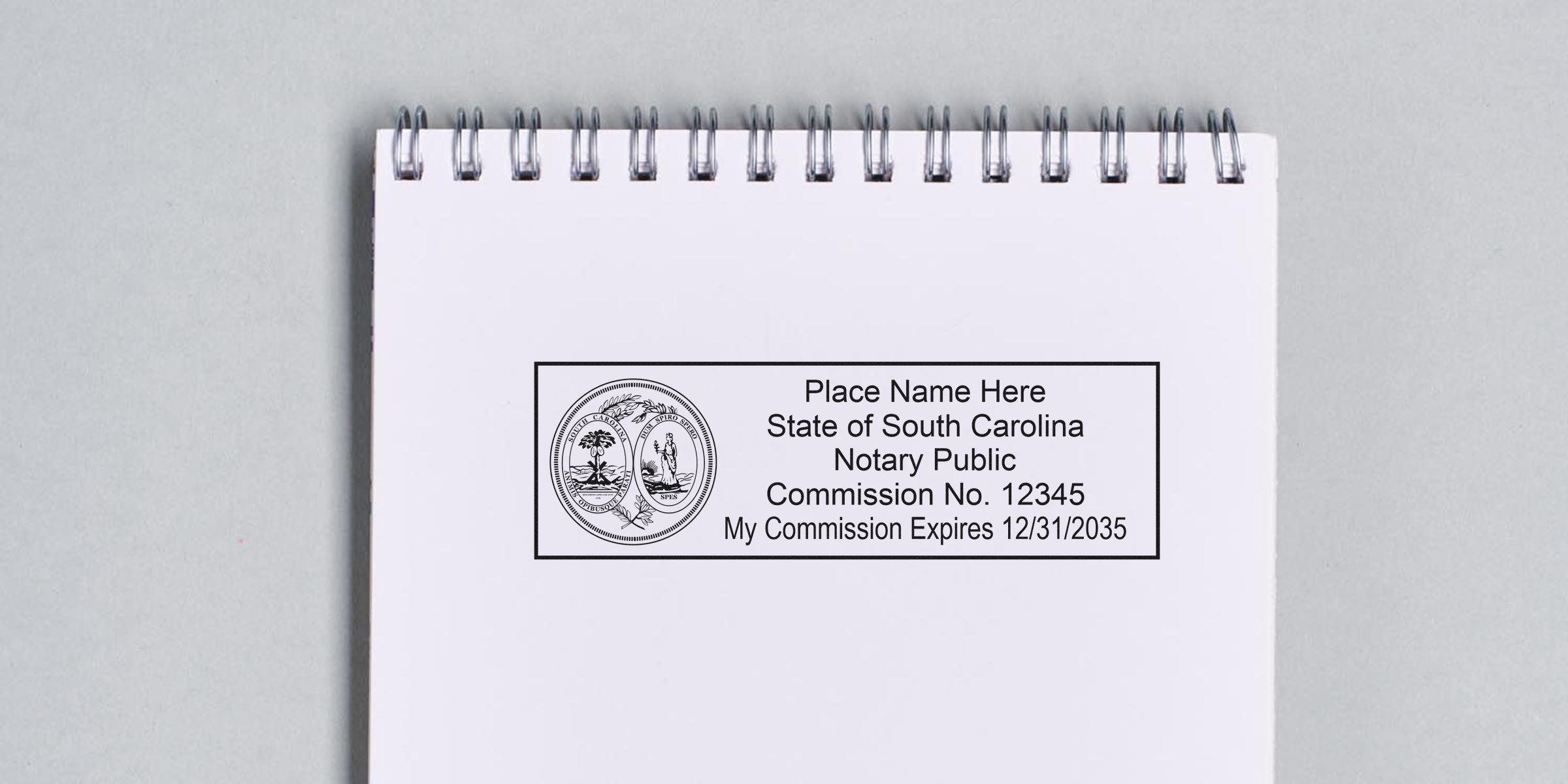 South Carolina notary seal and stamp shown on white spiral notebook, displaying commission number and expiration date.