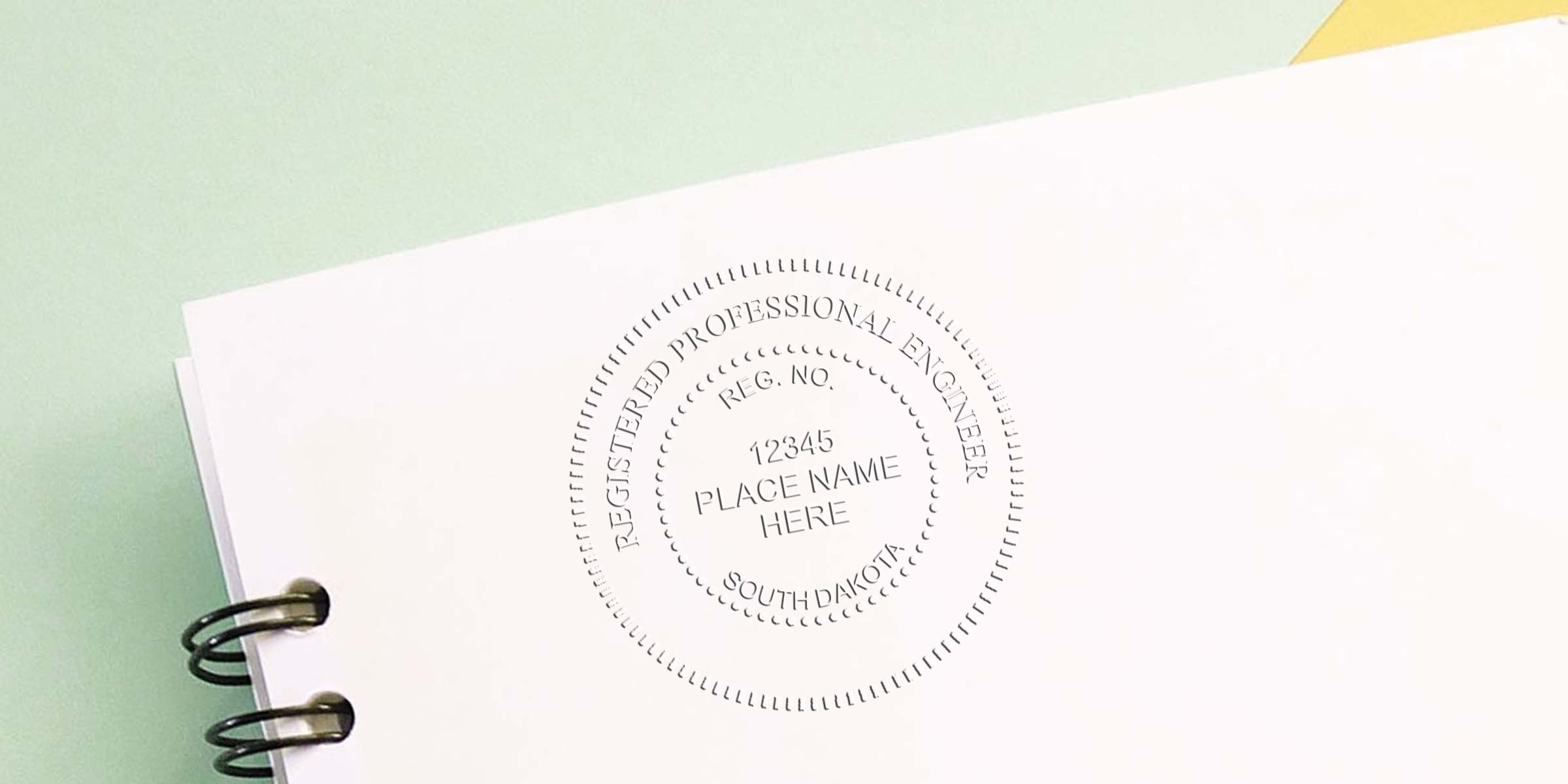 Registered Professional Engineer seal on white paper for South Dakota Engineering Services certification with Professional Engineer stamps.